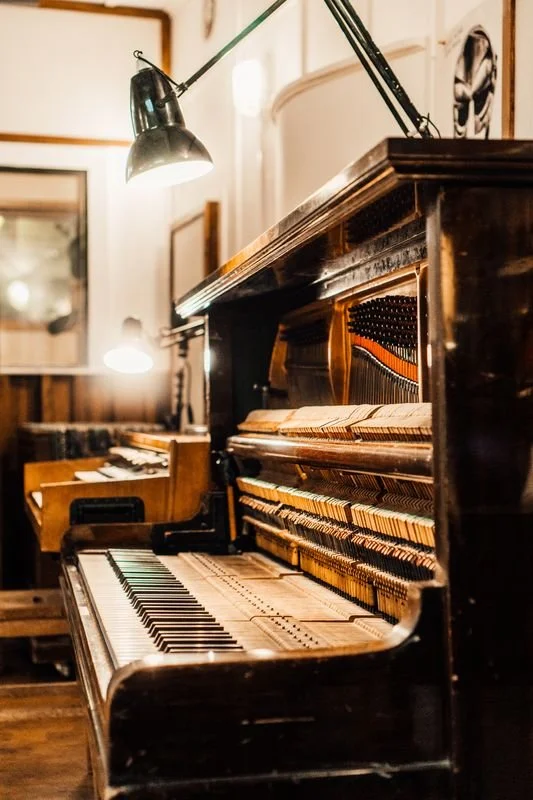 Broadwood upright piano sits open in the live room