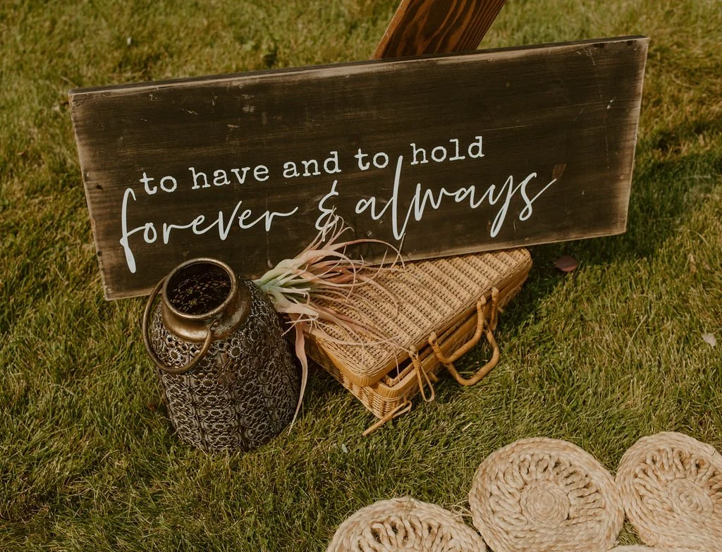 I never leave the base of the alter bare. This sign makes a statement and gives the guests something to look at while they wait for the main attraction.