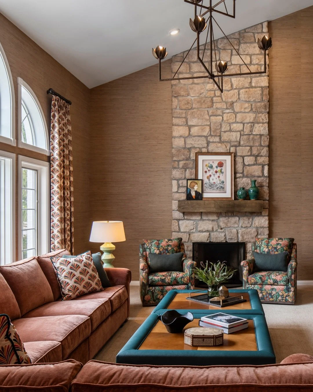 One of the biggest opportunities in this living room was the ceiling height. By extending the stone fireplace all the way to the top, adding custom cabinetry, and relocating the TV, the space became more balanced, more functional, and much more impac