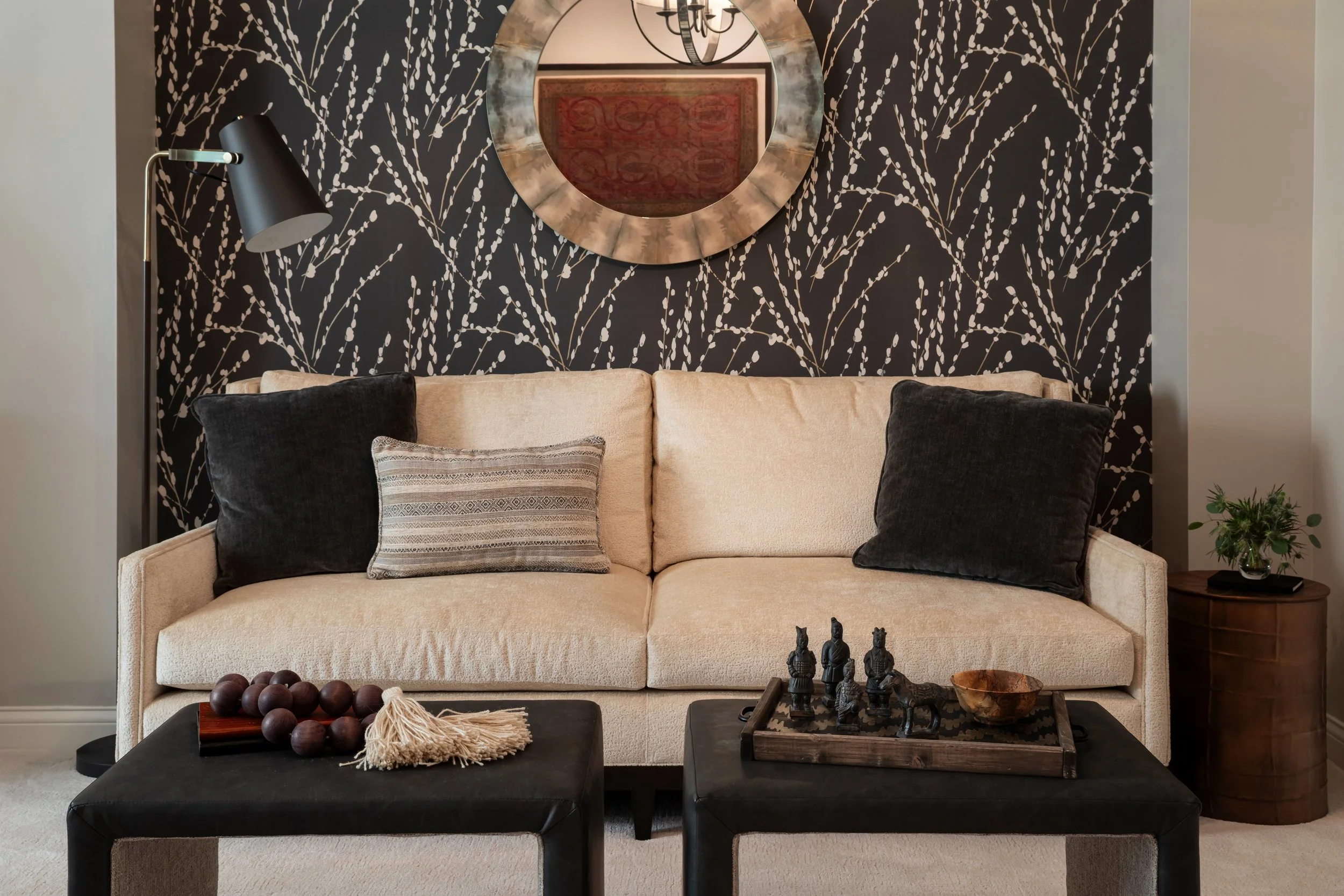 It&rsquo;s the layering that makes a room feel complete. Texture, pattern, lighting, and a few collected pieces that tell a story. &lsquo;Mikado Charcoal&rsquo; by @romo_fabrics is the perfect finishing touch in this sitting area.