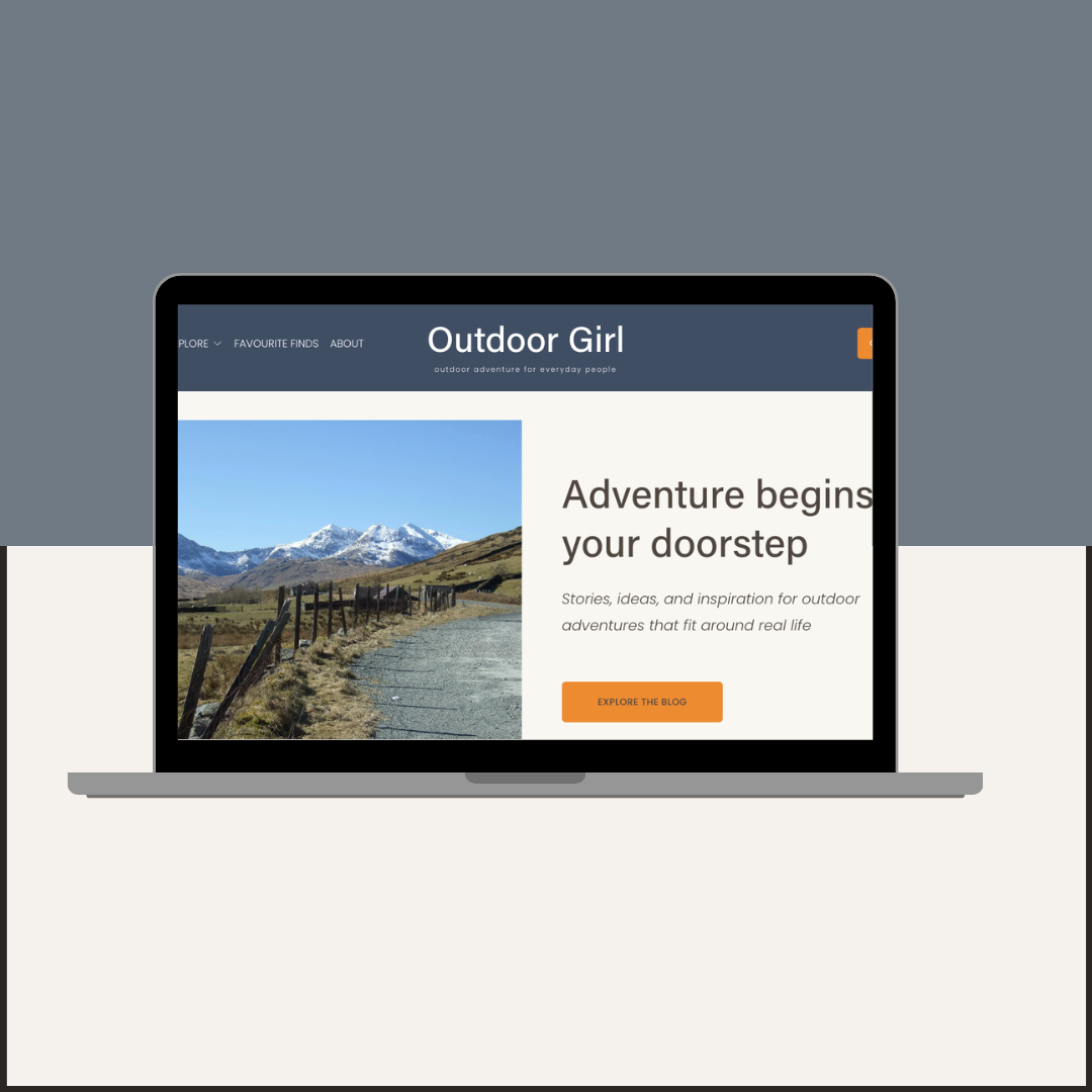 Computer laptop screen showing home page of Outdoor Girl website