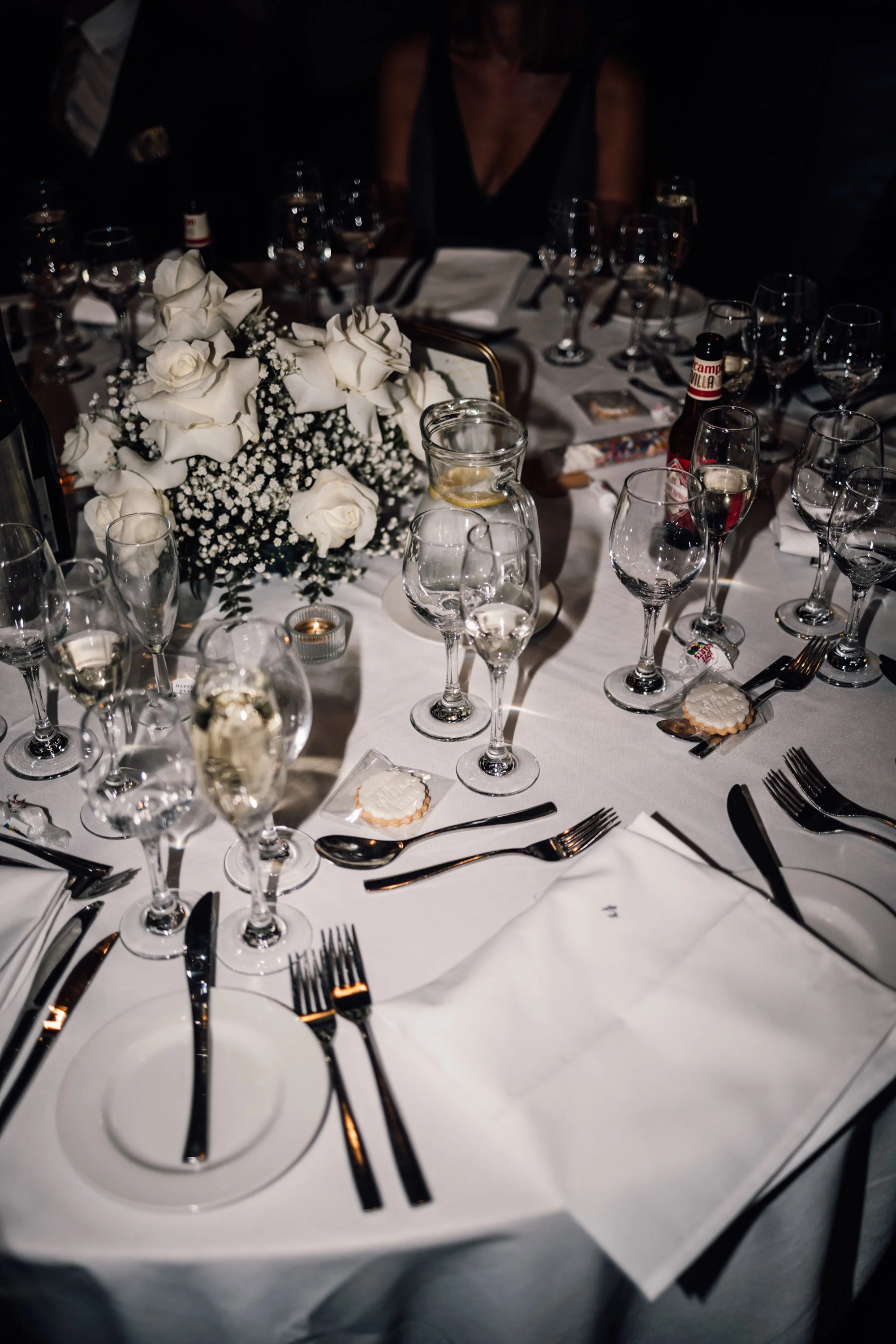 White floral wedding bouquet on rustic table at autumn West Mill wedding
