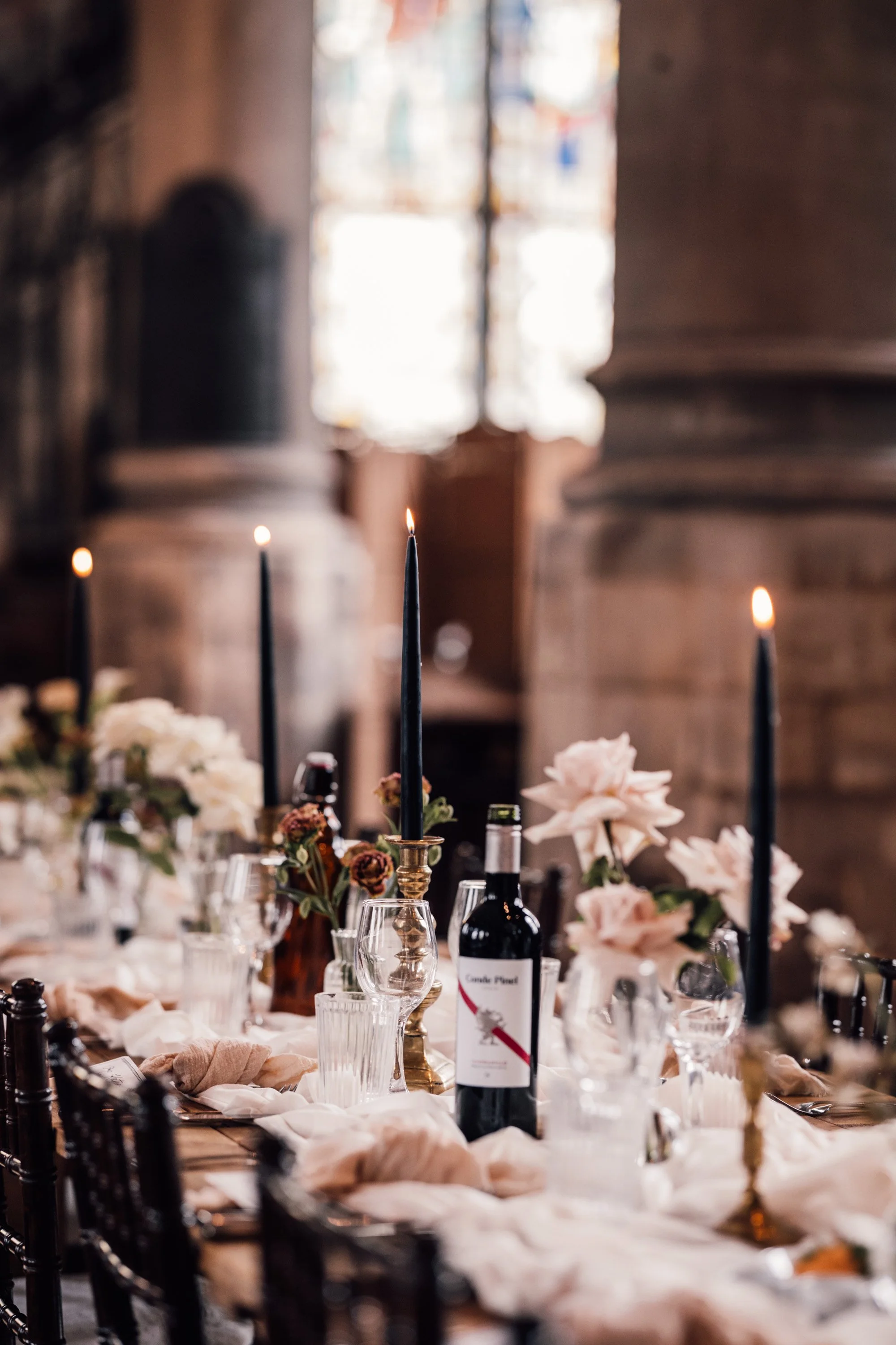 Wedding breakfast setup inside The Mount Without with candlelit tables