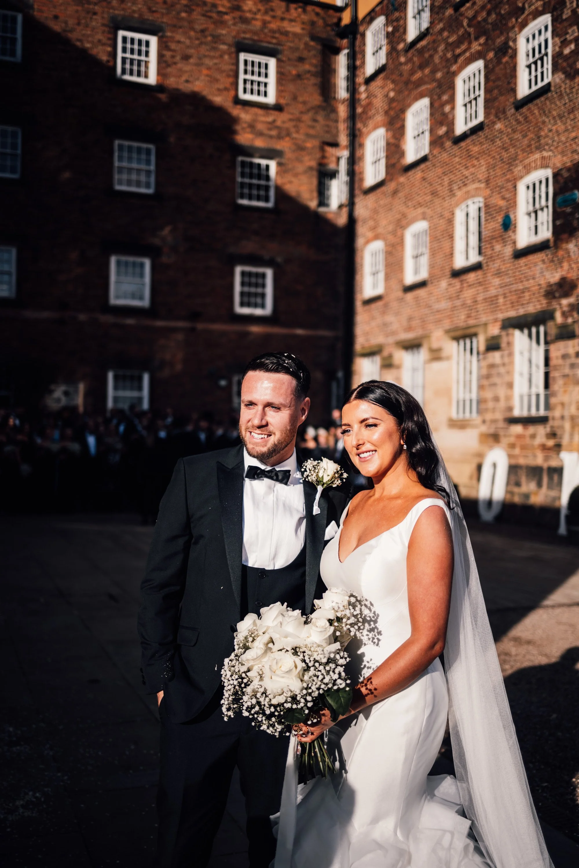 Classic black tuxedo groom style for a black tie wedding at The West Mill