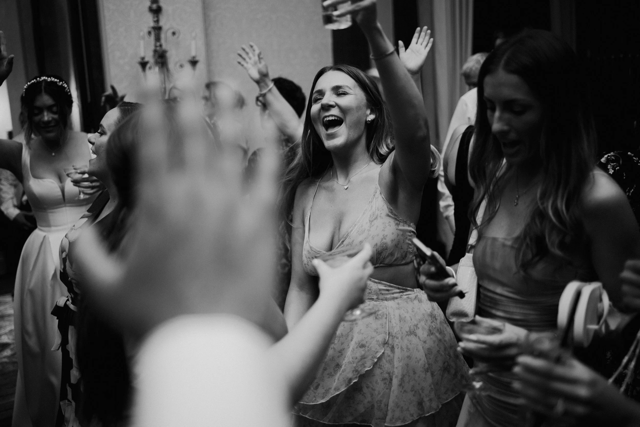 Staffordshire wedding photography, black and white image of guests on the dance floor