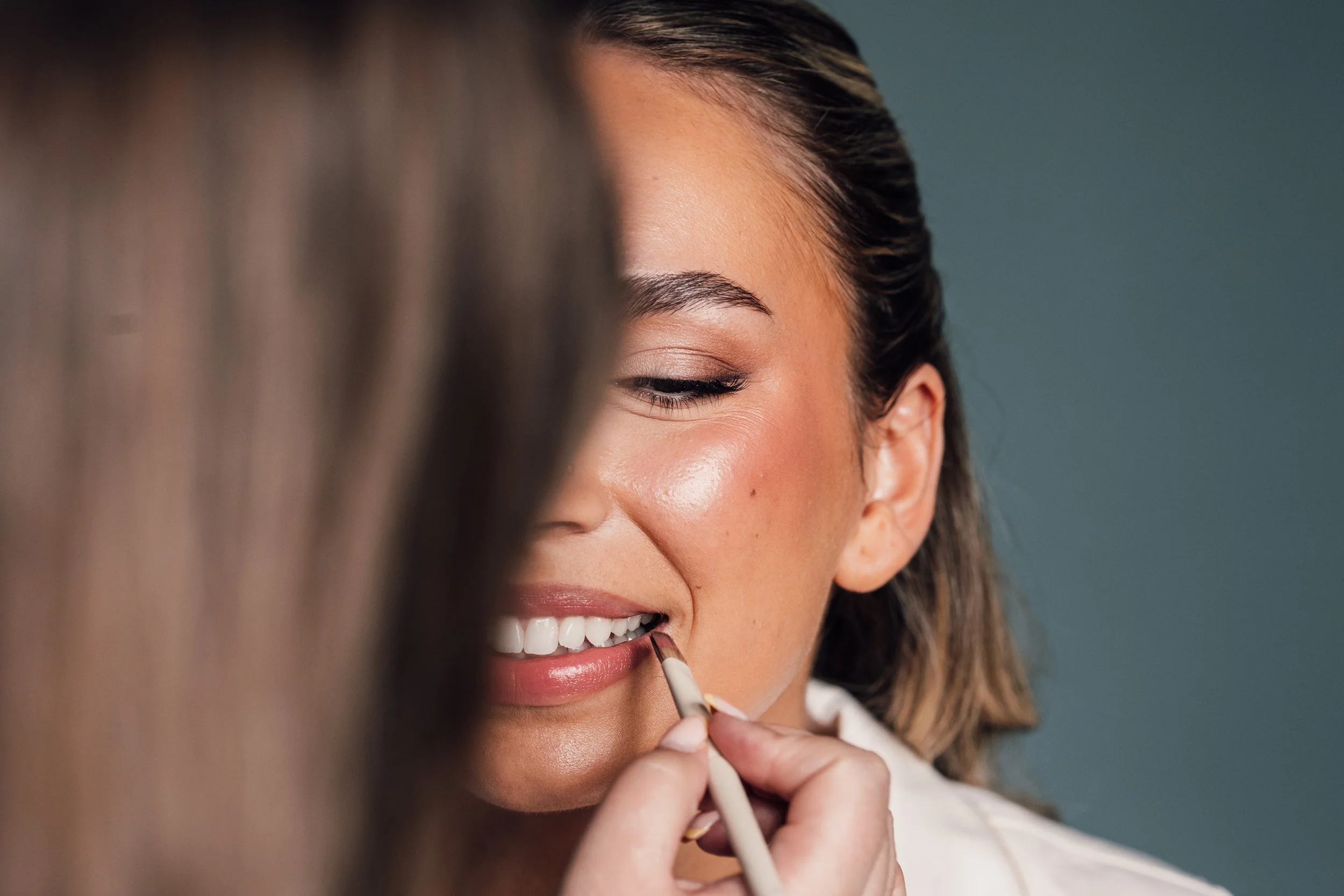 Close up image of bride getting makeup done in Derbyshire