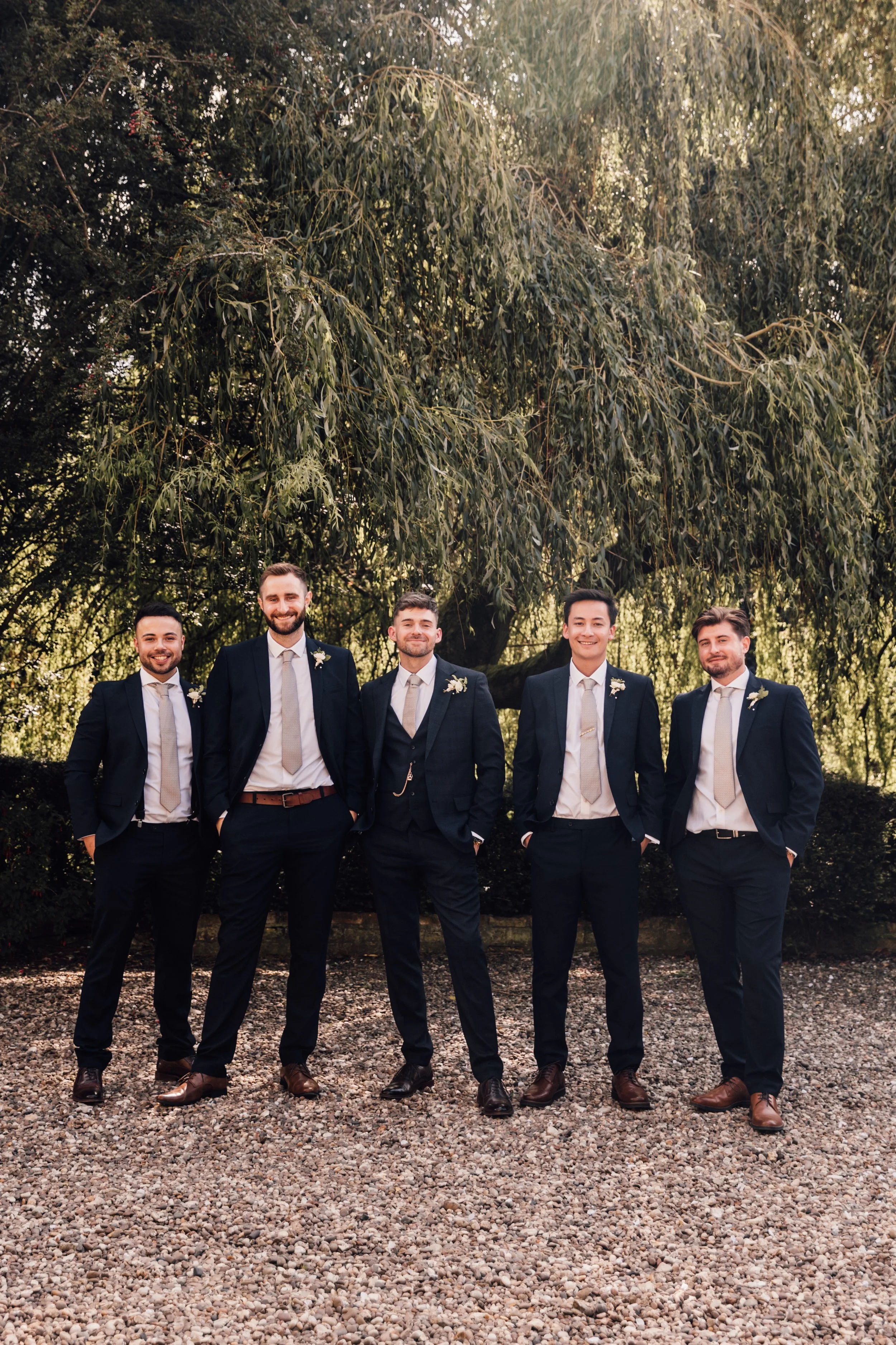 Relaxed groomsmen photo at Wootton Hall Estate in Lincolnshire