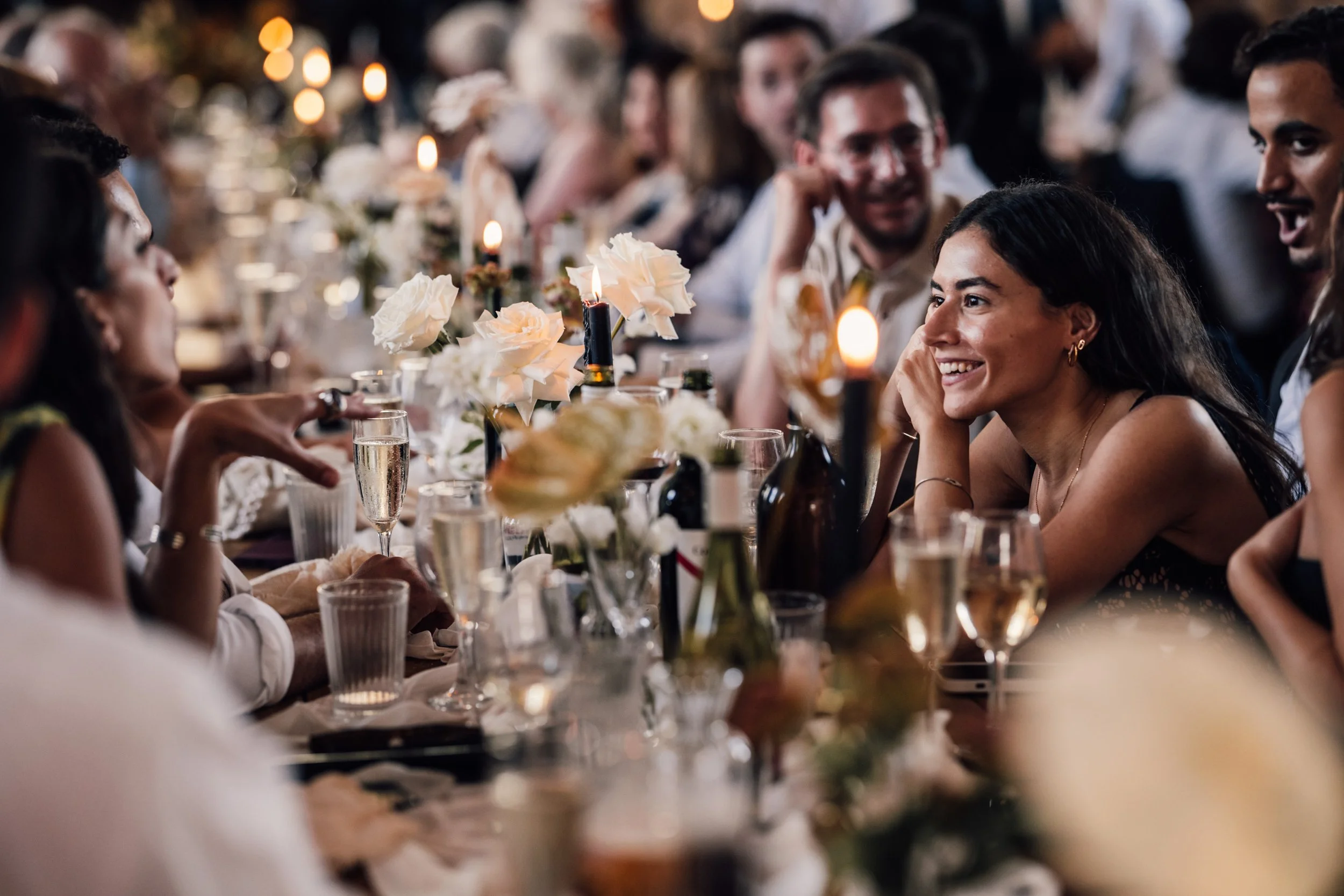 Candid wedding photography of guests during dinner at the mount without wedding