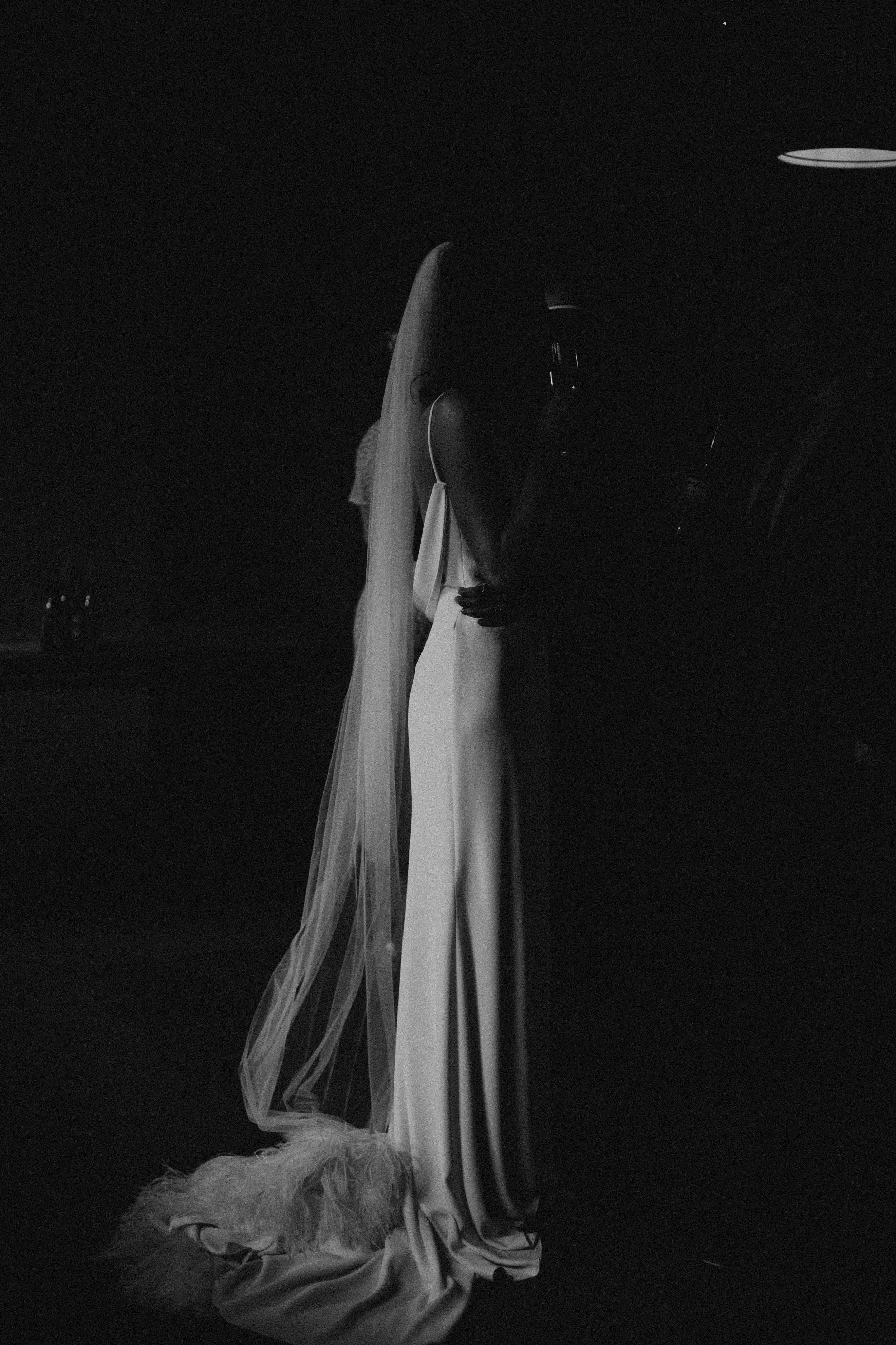 Candid black and white photo of bride at The West Mill wedding