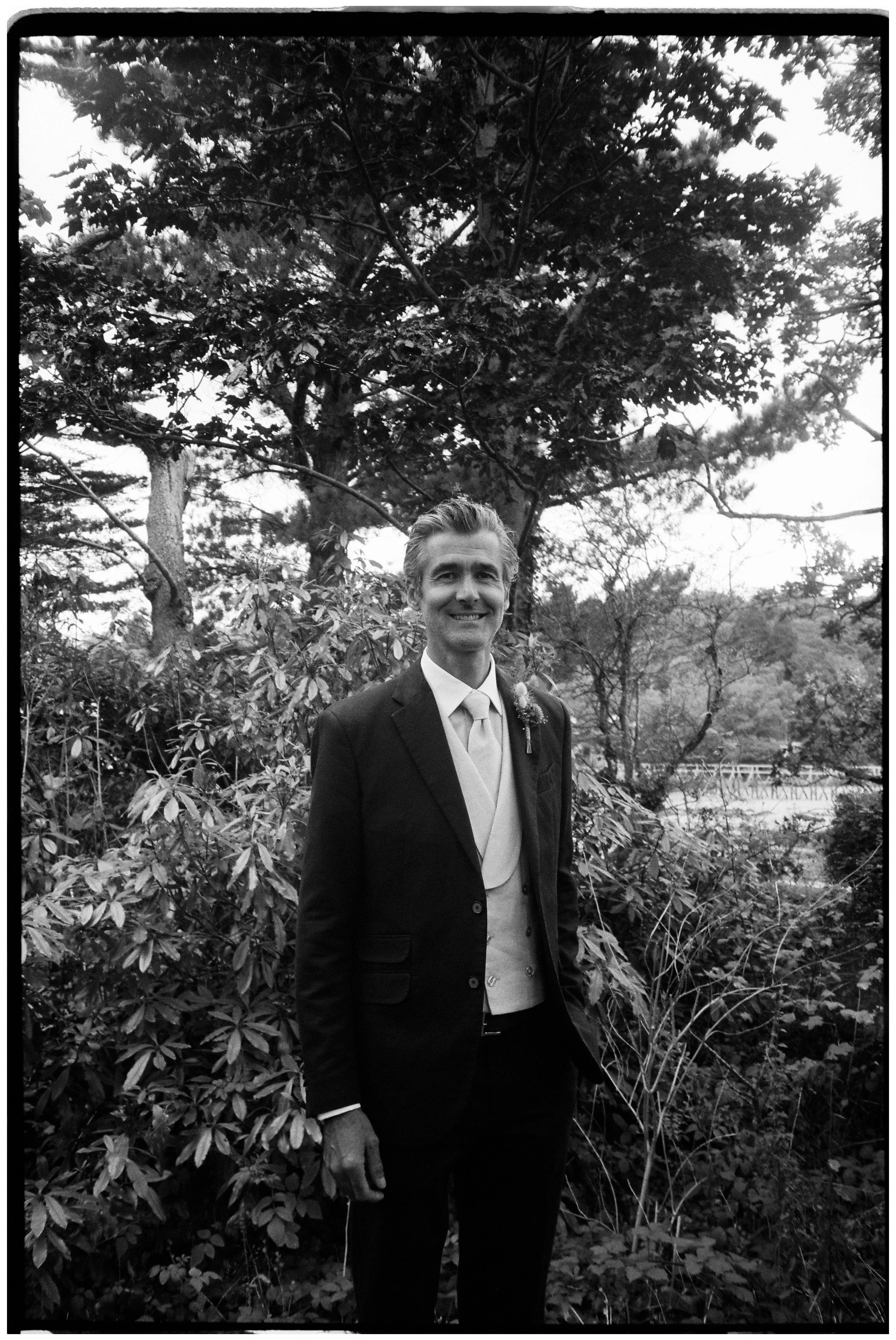 Groom wedding photo on black and white 35mm film