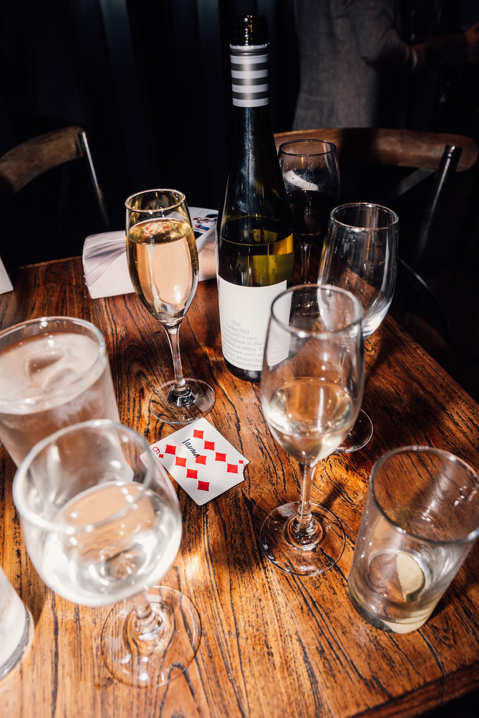 Direct flash evening details of glasses and cards at Staffordshire wedding