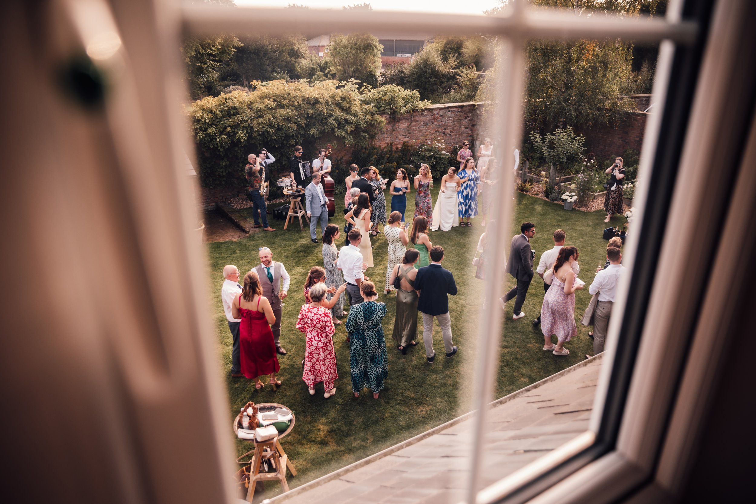Overlooking view of the garden reception from an upstairs window at a Lincolnshire wedding
