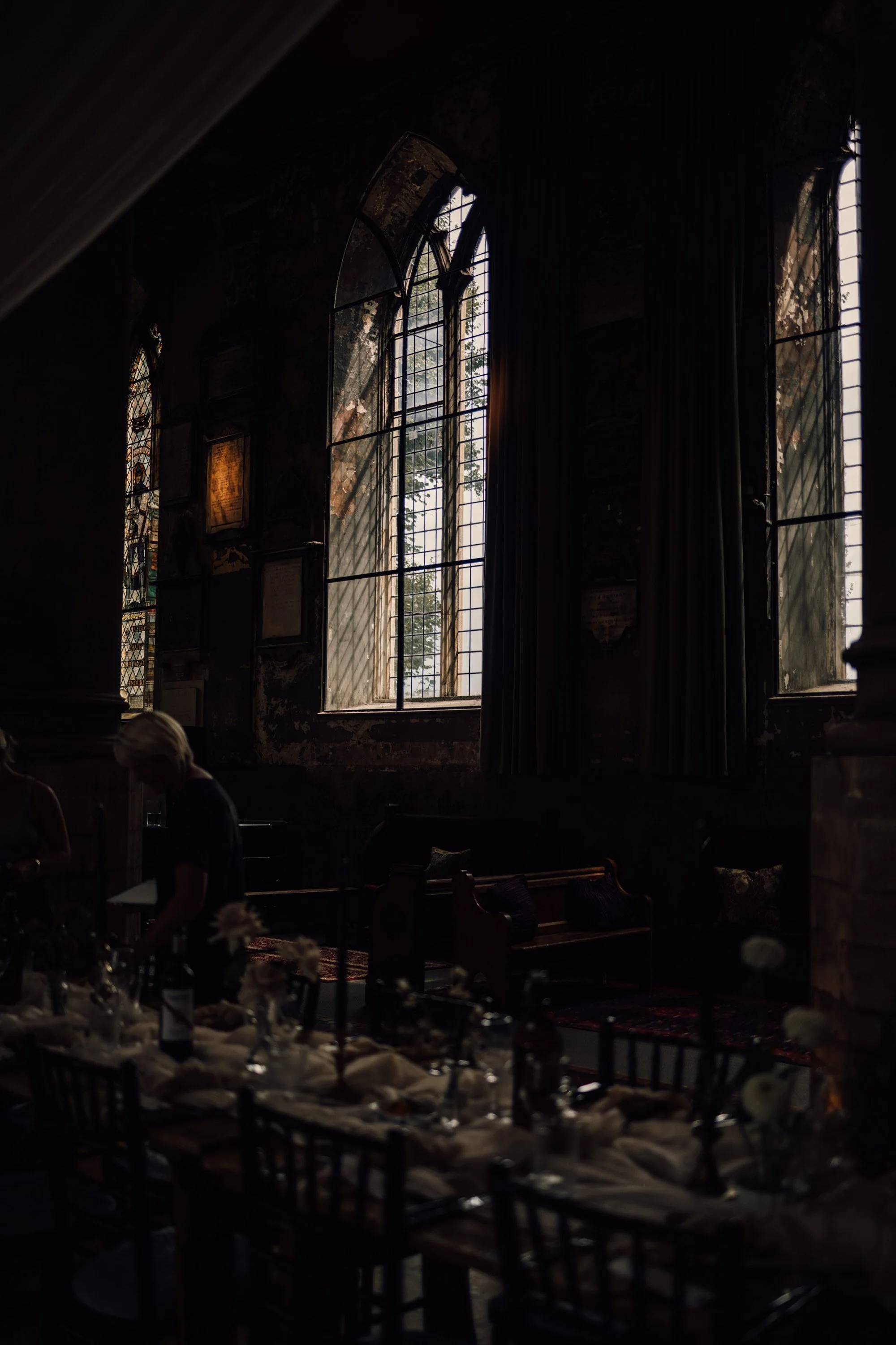 Atmospheric wedding photography with candles and stone architecture in Bristol