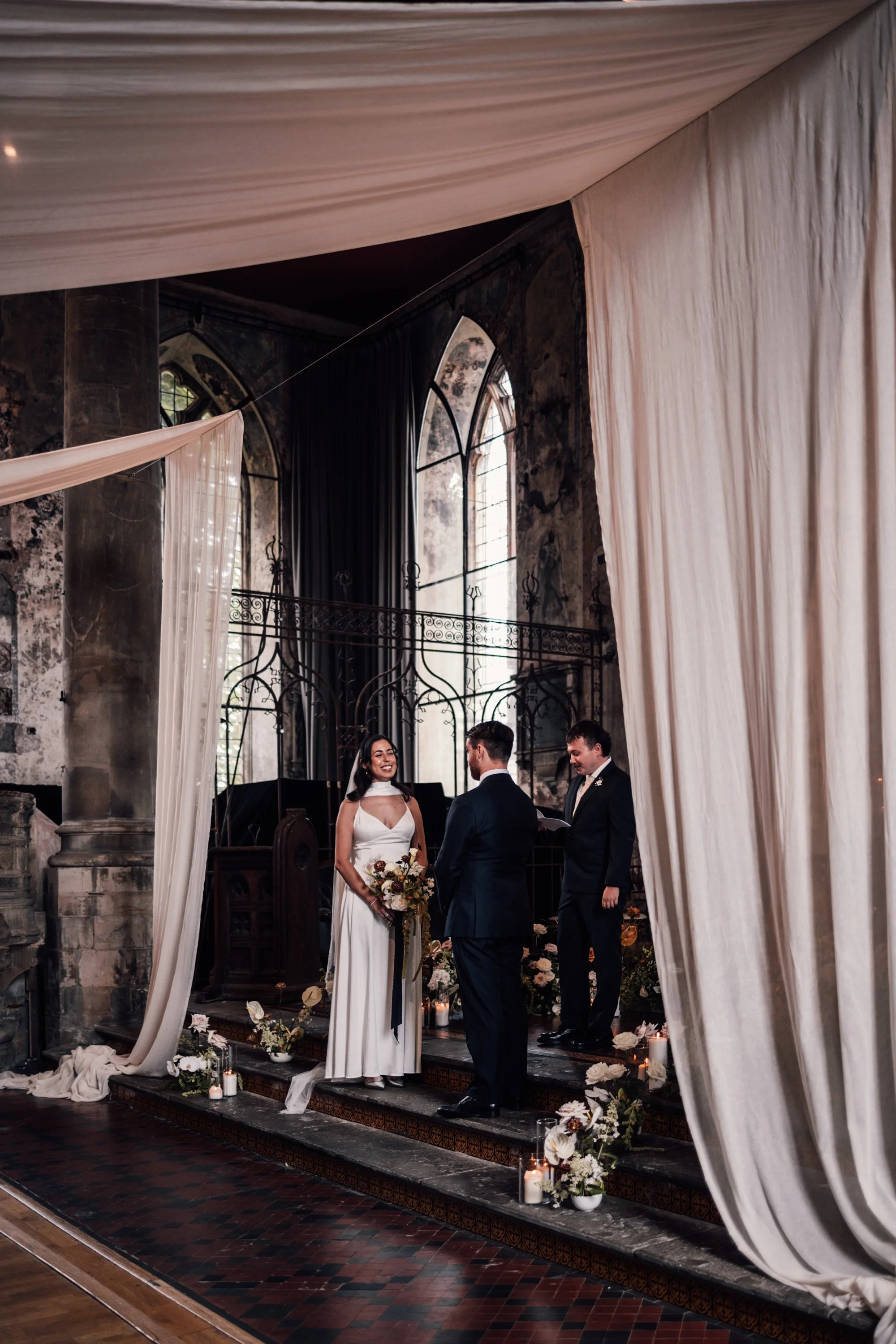 Intimate wedding ceremony inside restored church venue in Bristol