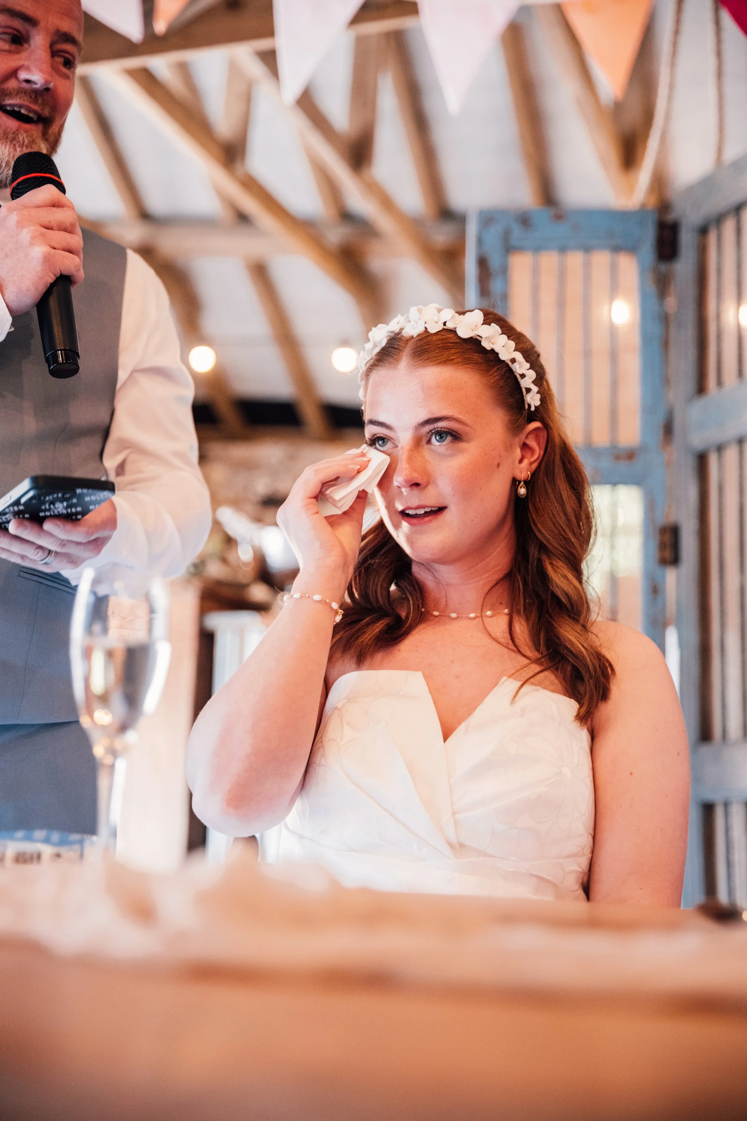candid wedding photography of bride crying during speeches at Cornwall wedding