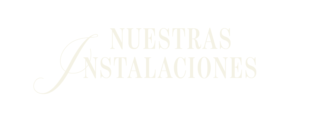 Texto en color blanco que dice 'NUESTRAS INSTALACIONES' sobre fondo negro.