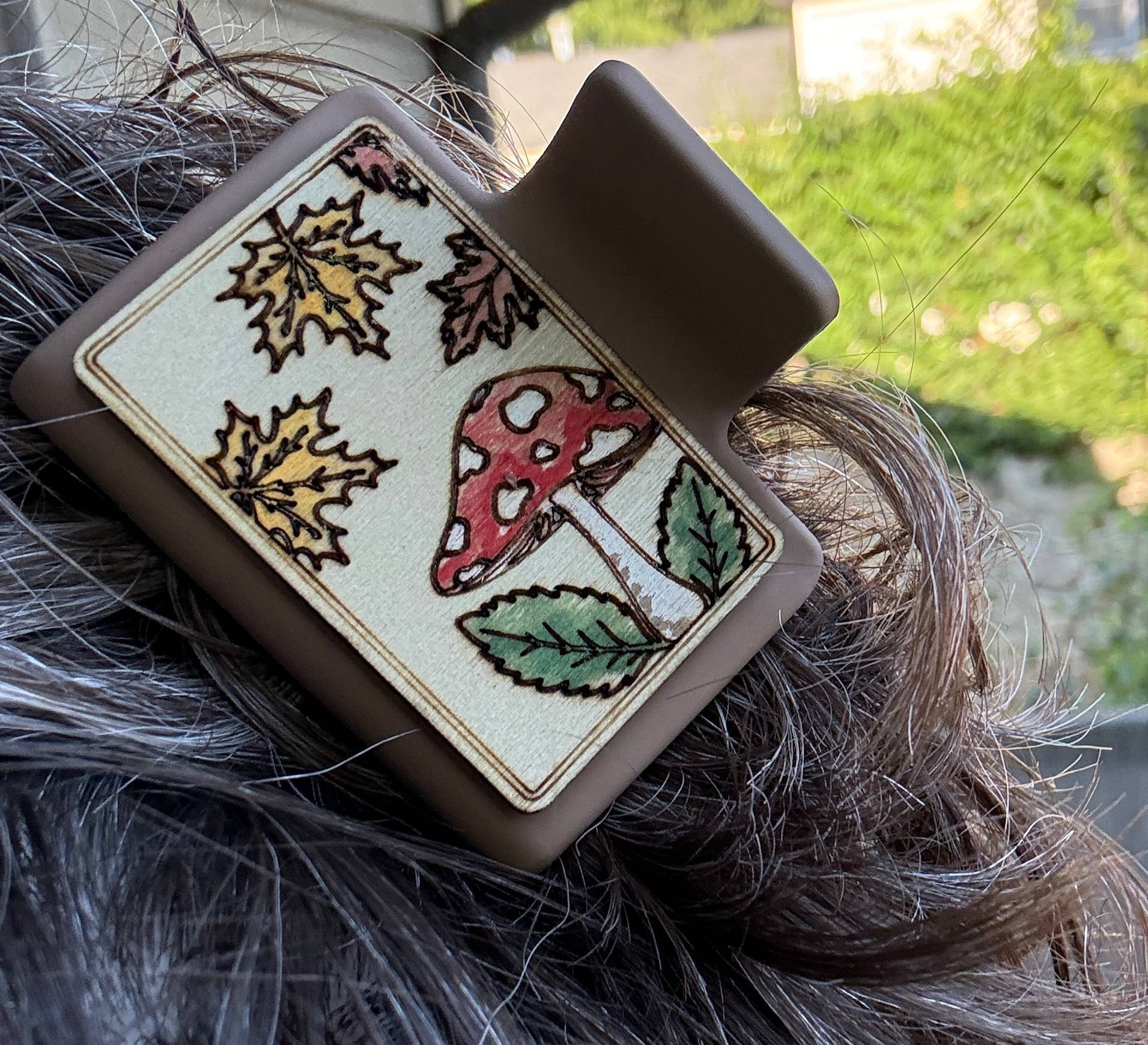 left view of the Autumn claw clip being used