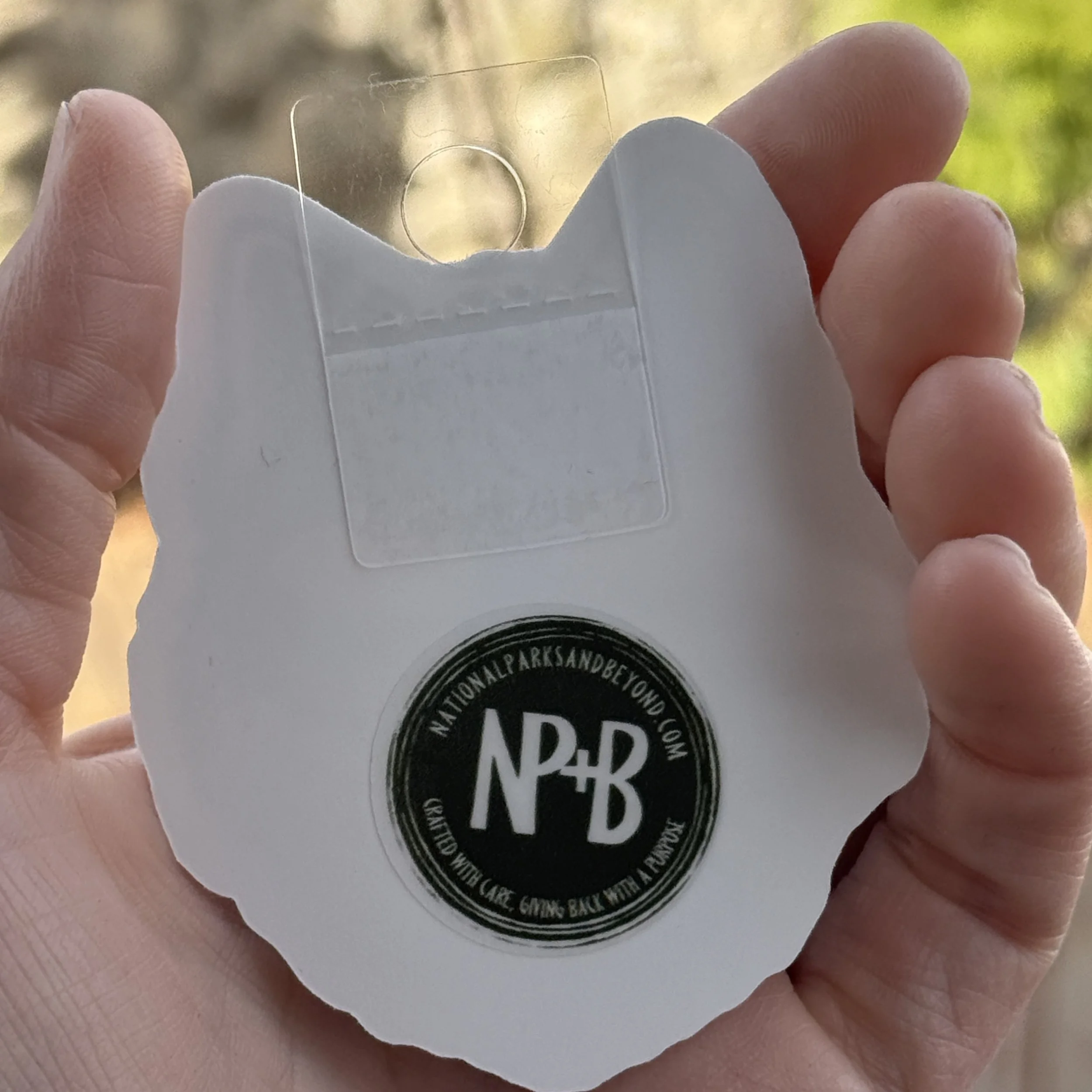 Back of sticker with the NPB logo and a hang tag added to the stickers