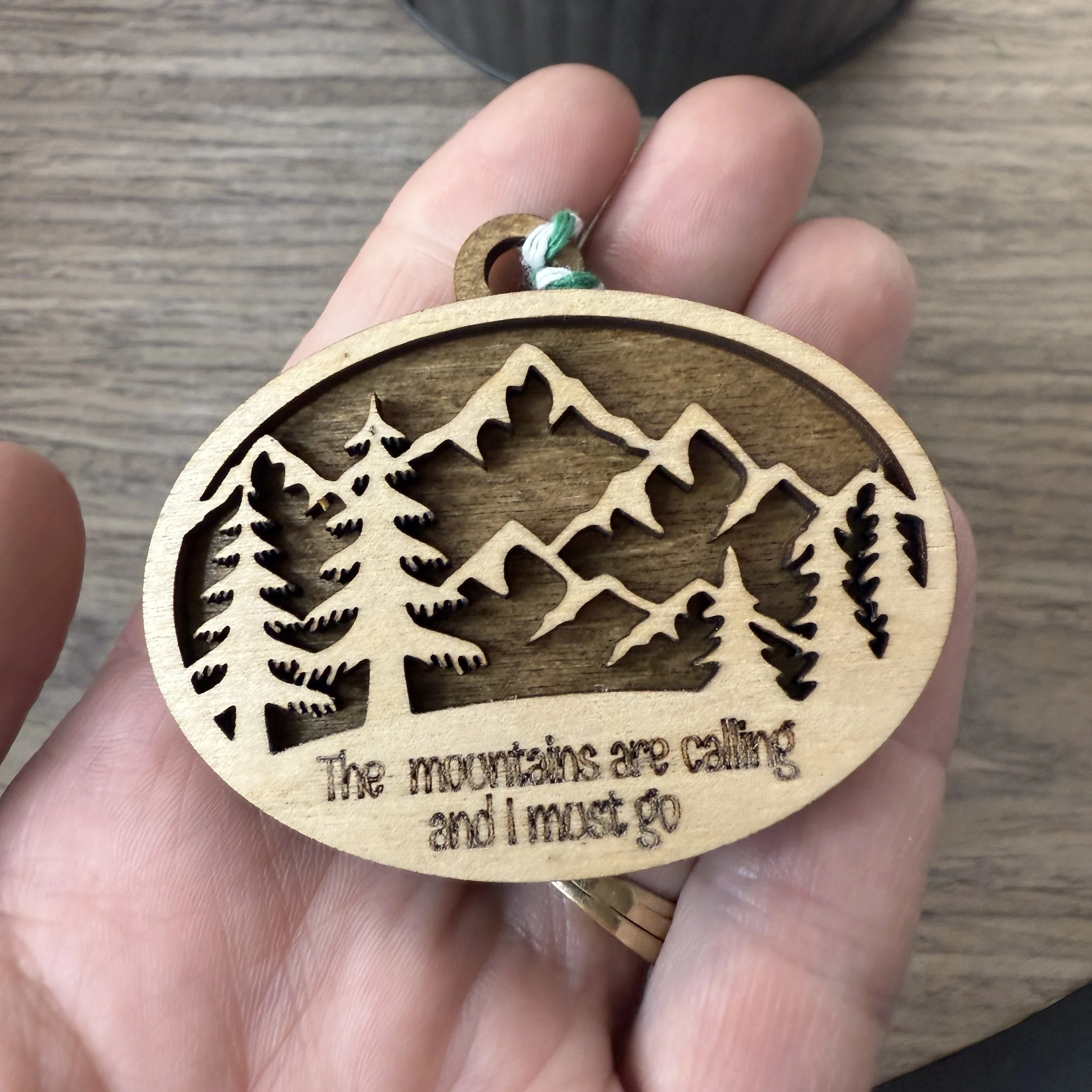Mountain Range Oval Ornaments in the palm of a hand