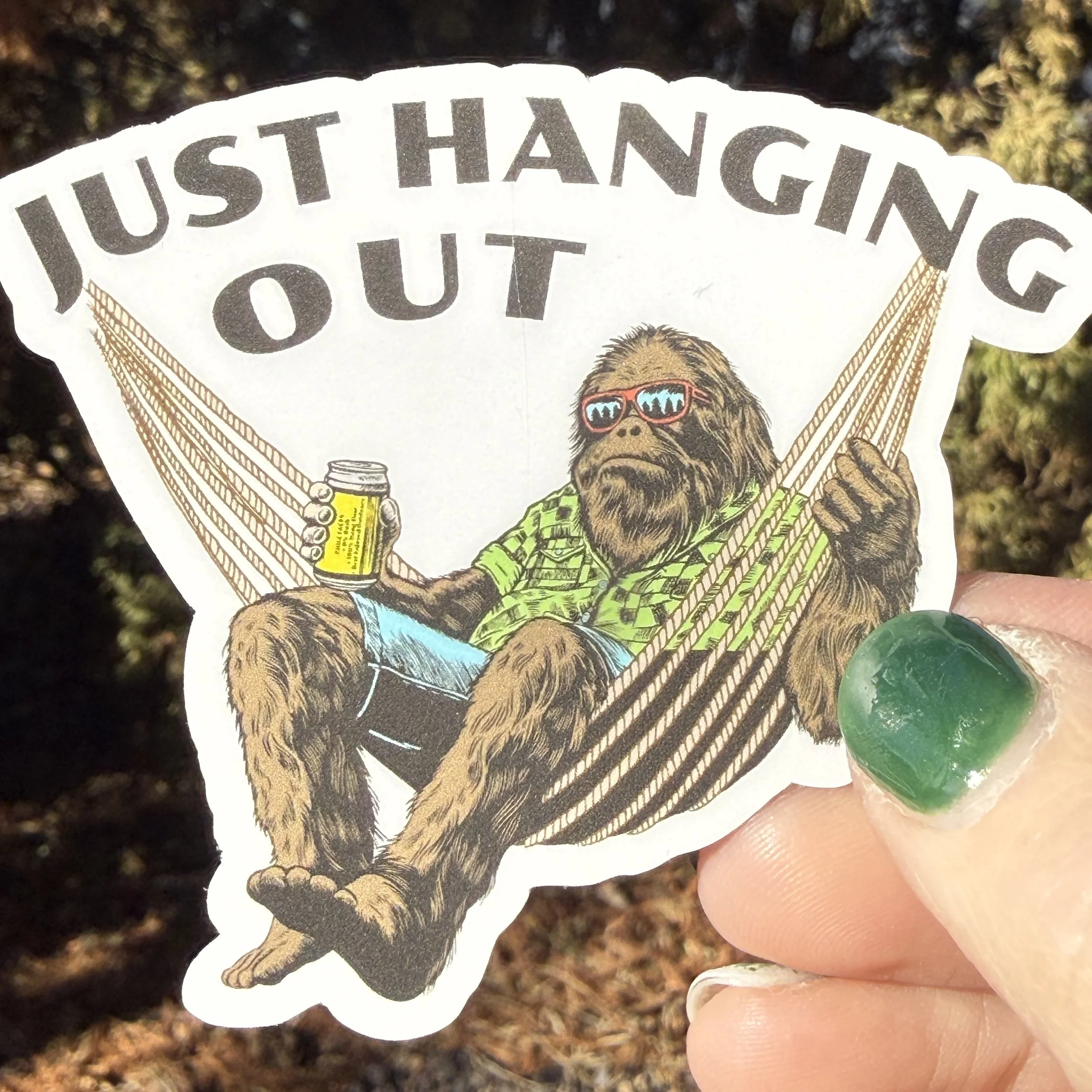 Up close image of the bigfoot in a hammock sticker