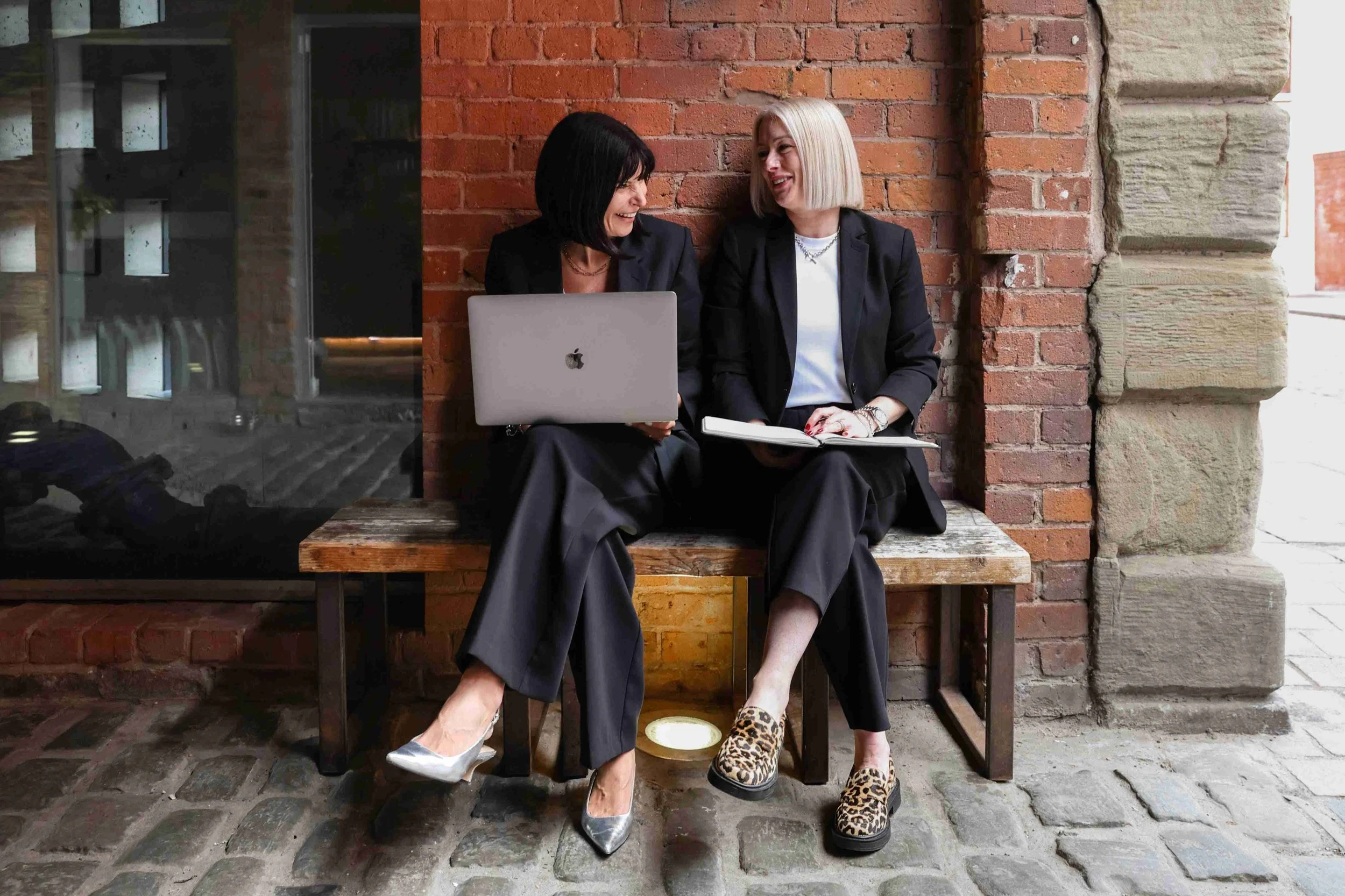 Anna Jones working with a female business owner to plan her marketing strategy and content