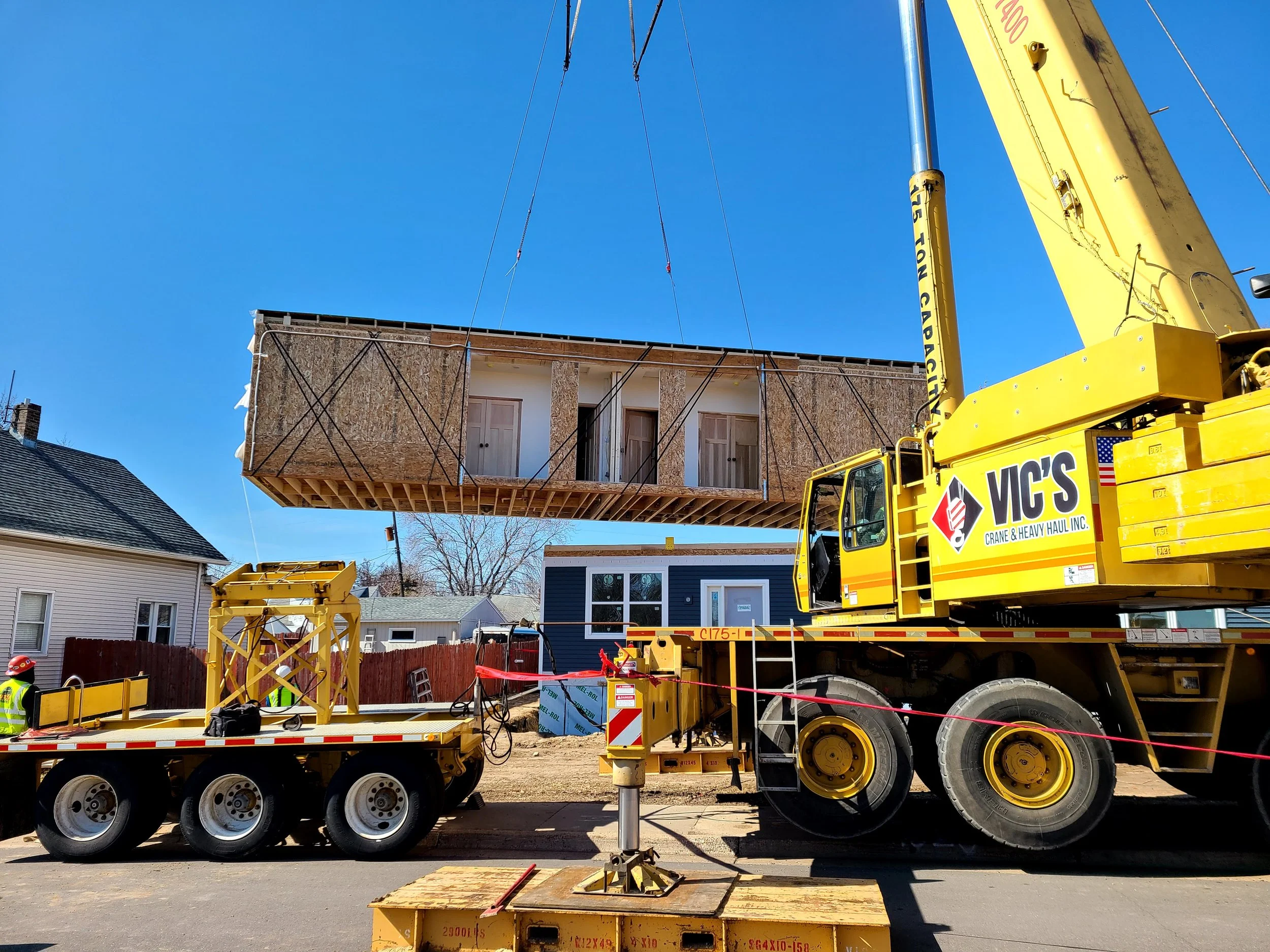Crane setting a house module