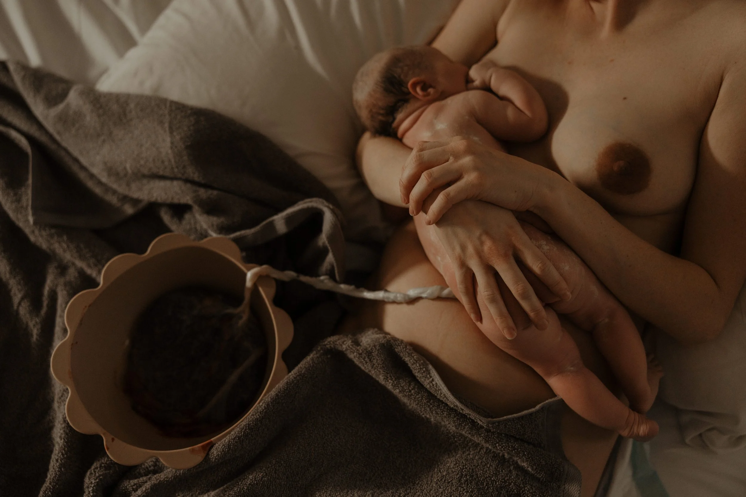 Cozy in bed after a home birth