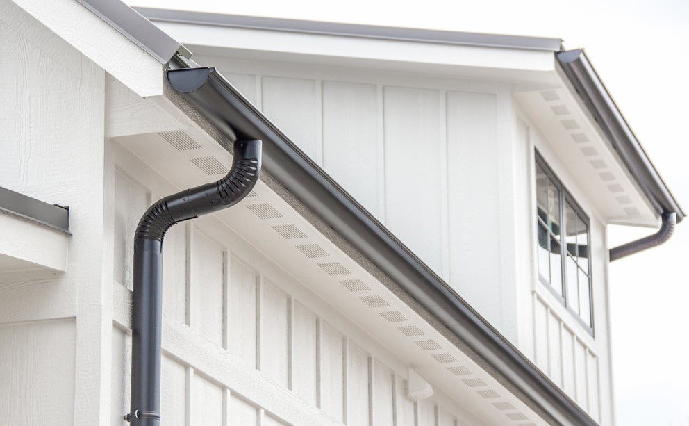 halfround gutters with hidden brackets & 4 inch round downspouts.jpg