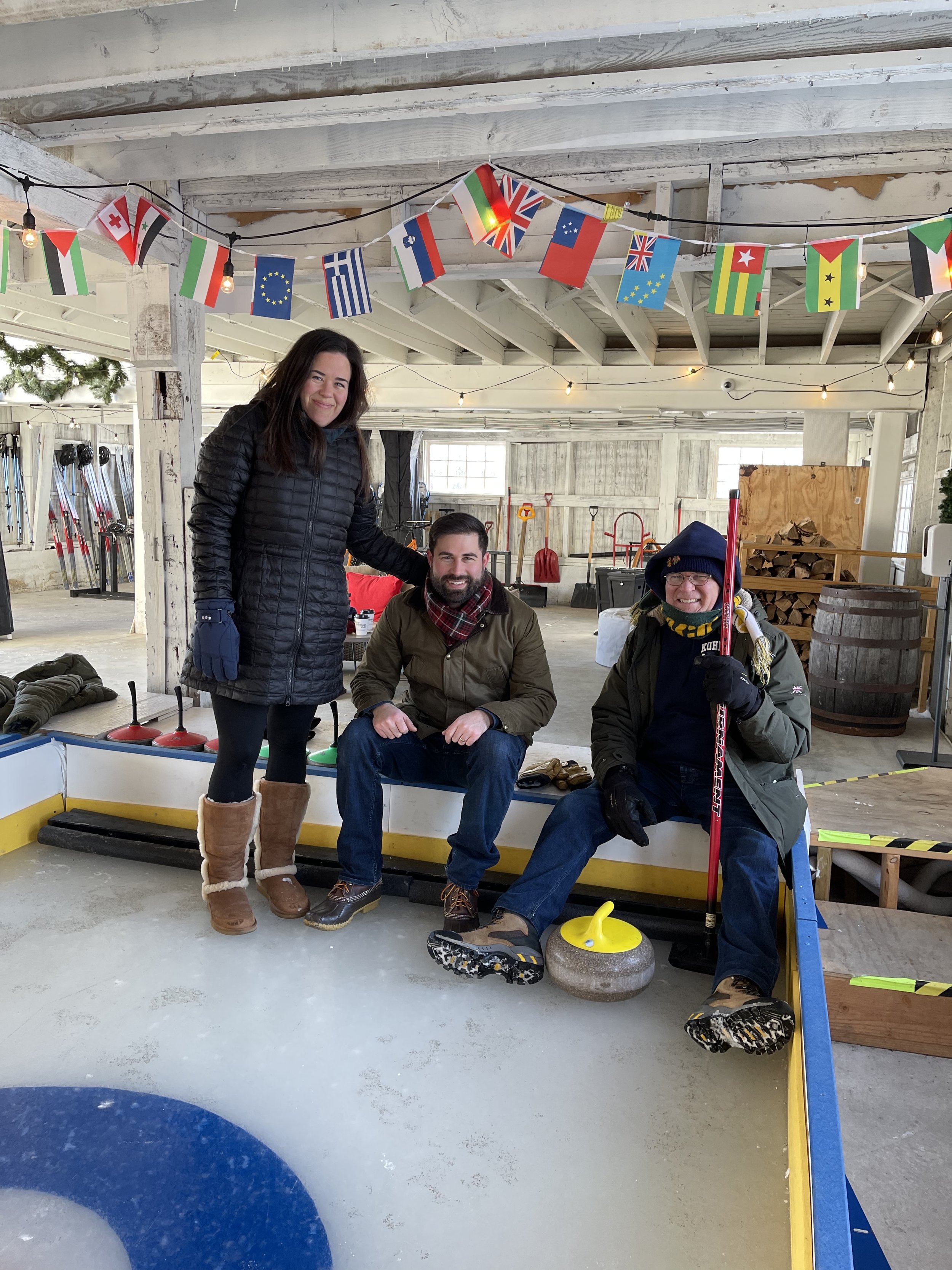 Testing our winter sports skills while curling on the ice.jpeg