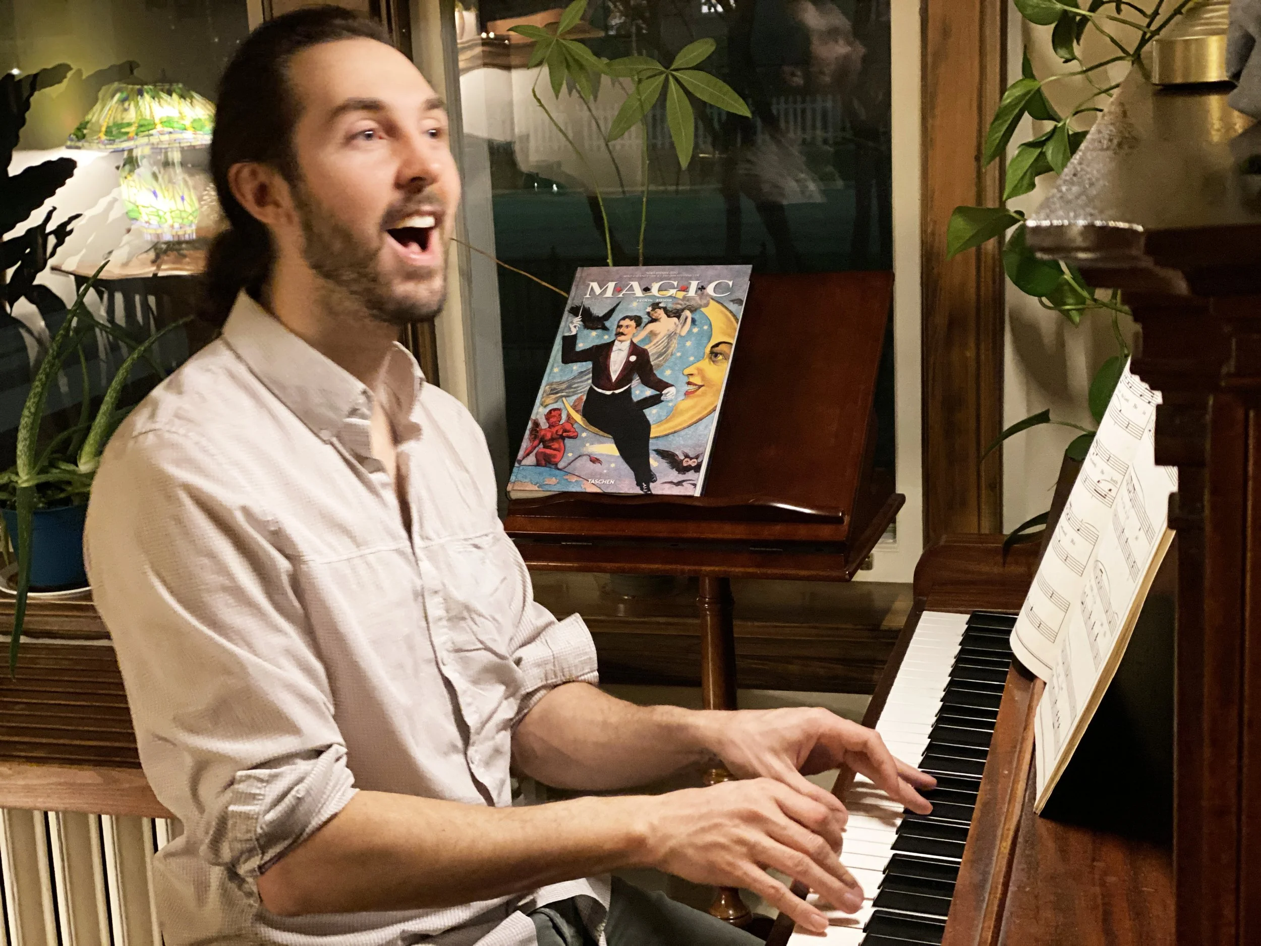 Sean singing at the piano.jpg