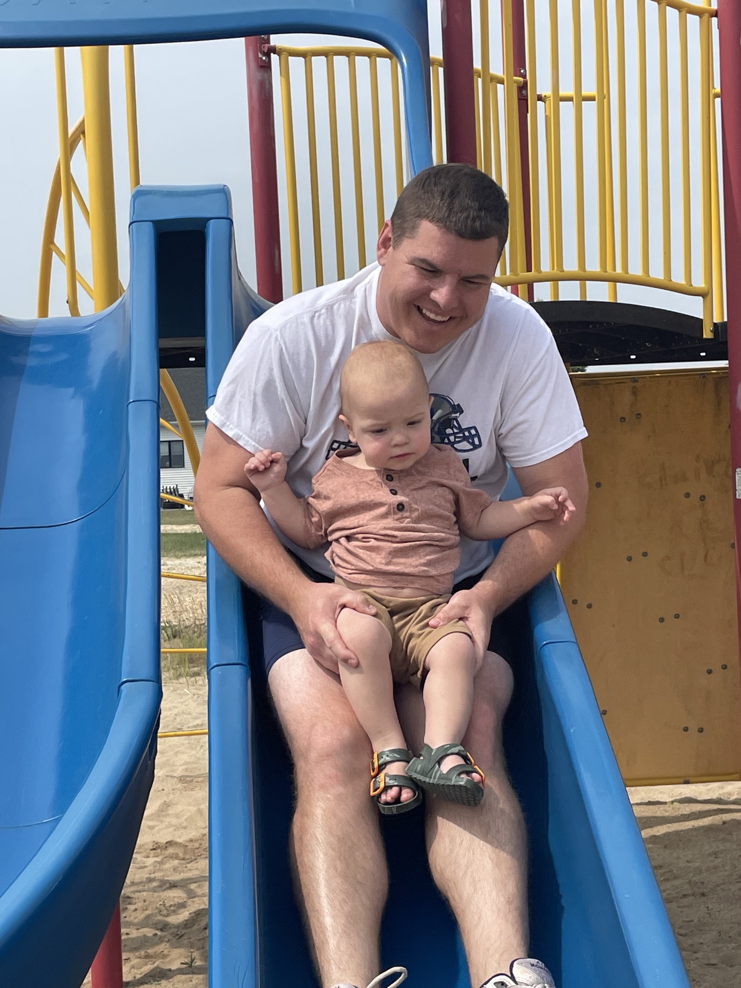 Peter enjoying time with Robert on the slide.jpg