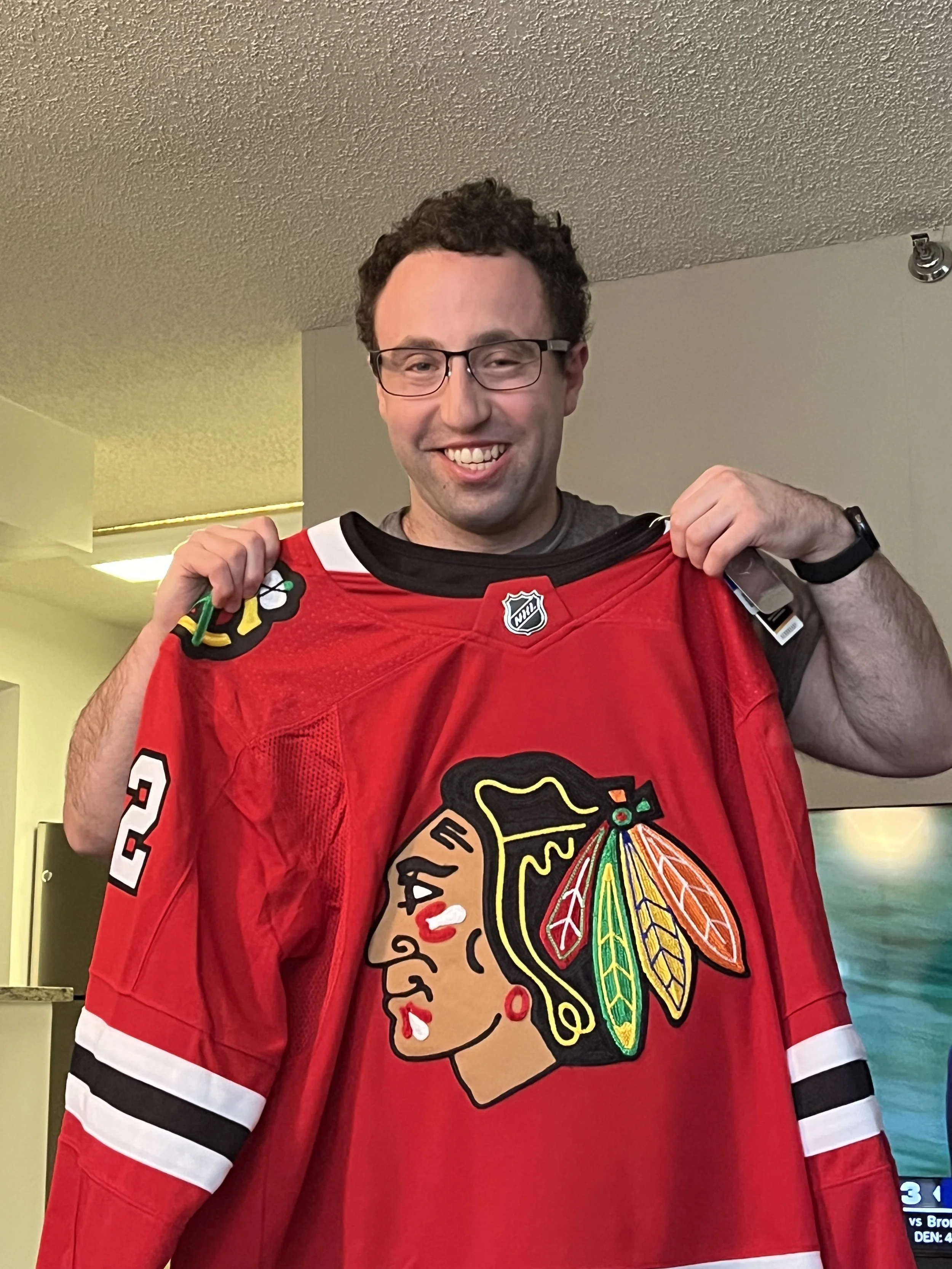 Bryan with his new Blackhawks Jersey.jpeg