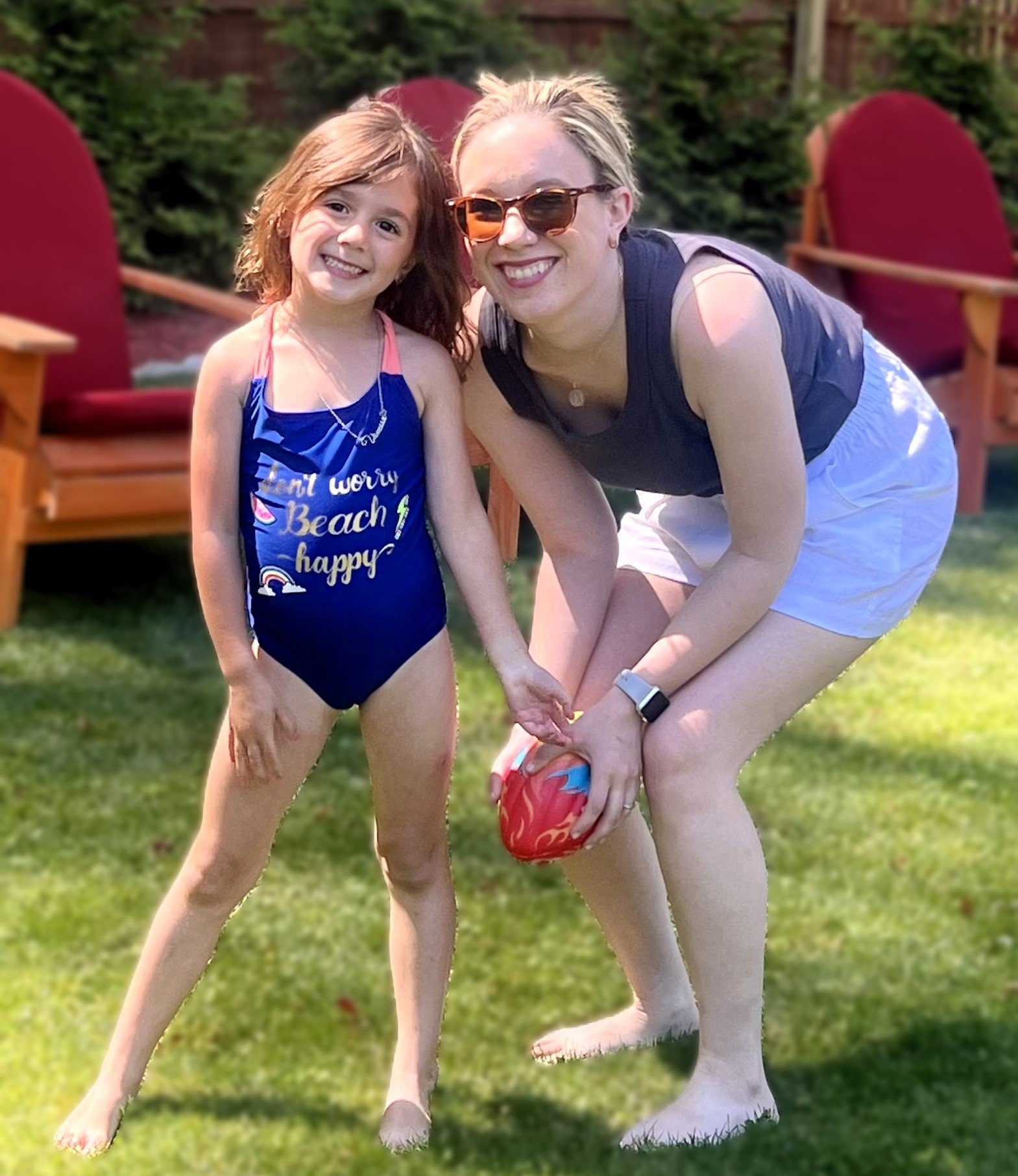 Emily's niece playing catch in their yard.jpeg