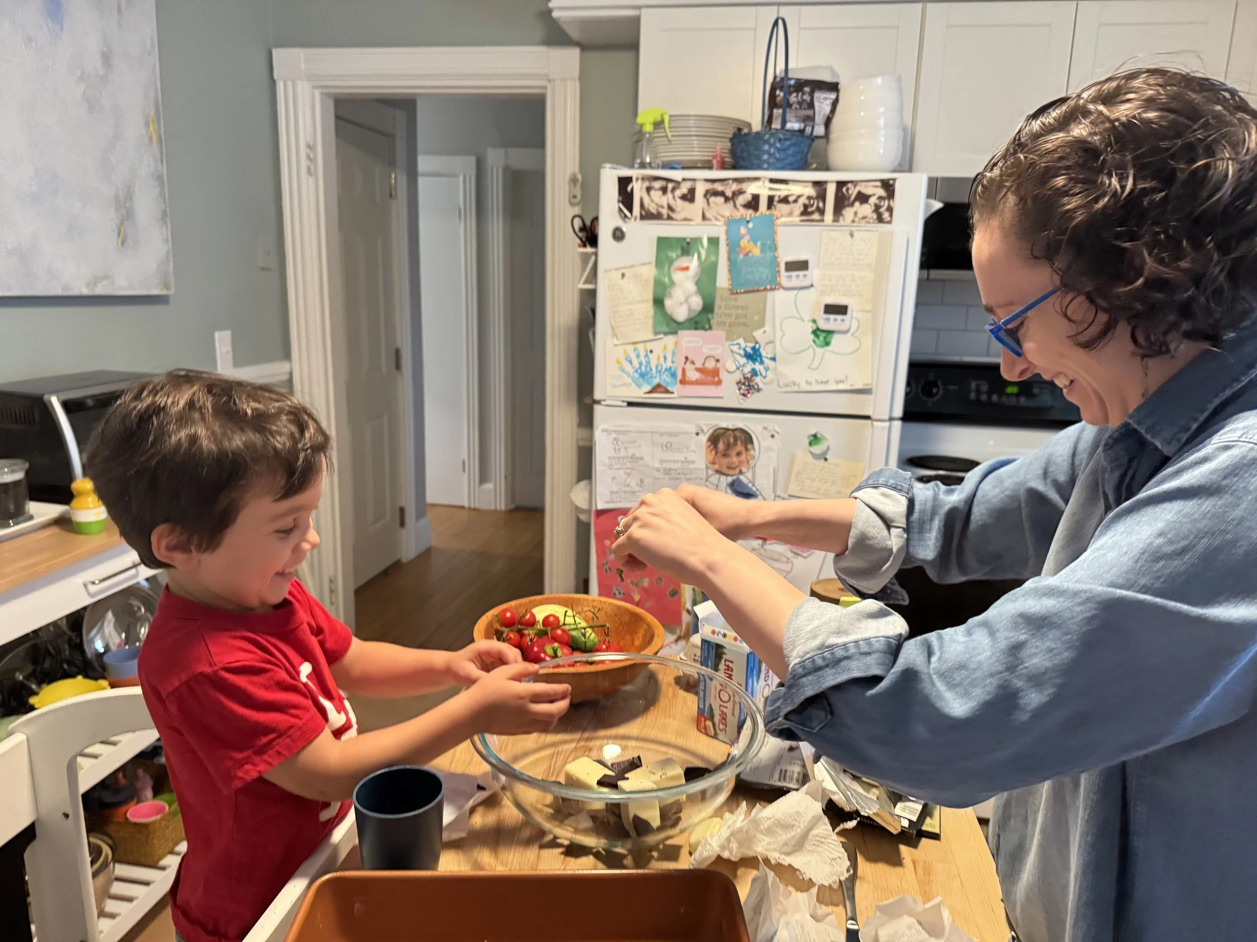 Rosie teaches her friends’ kids to bake.jpg