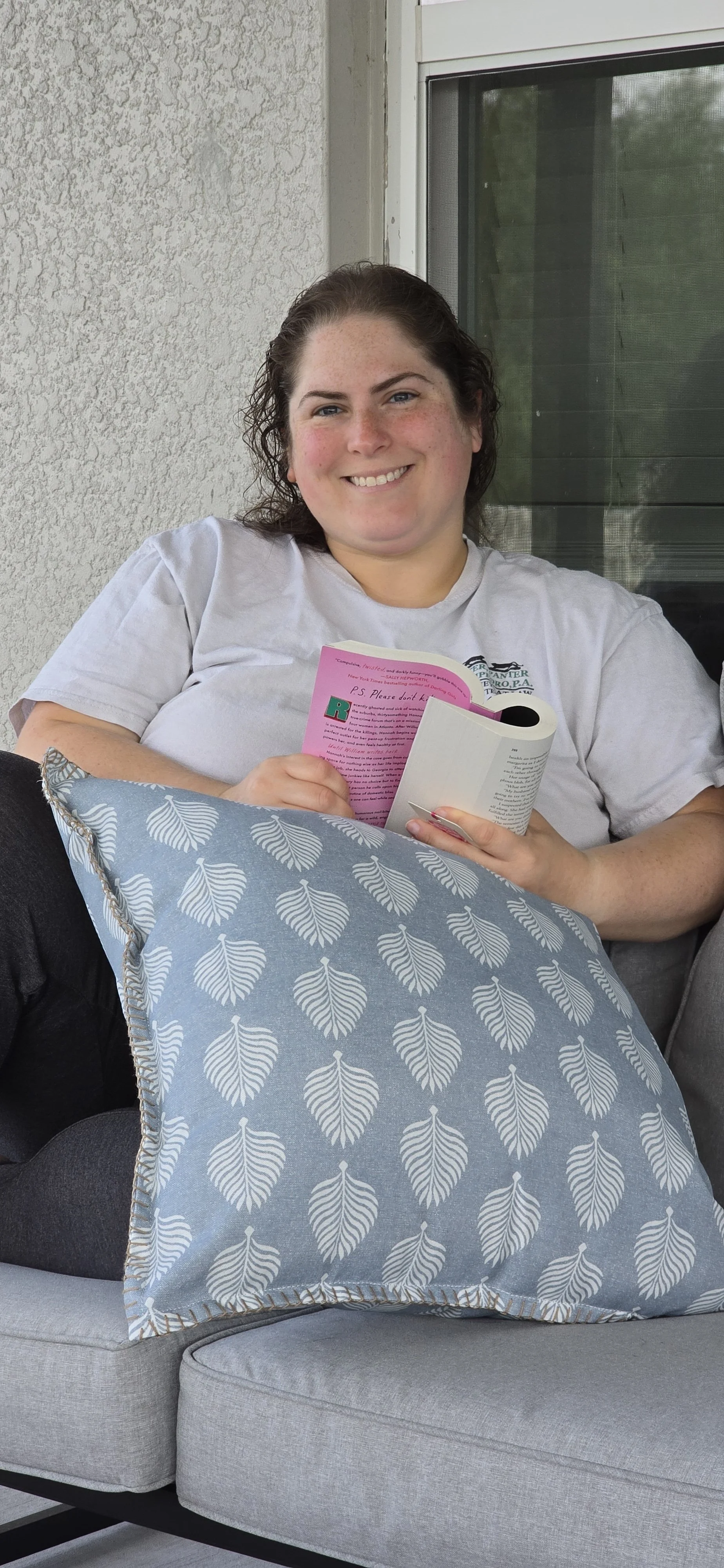 Zoey reading on the patio.jpg