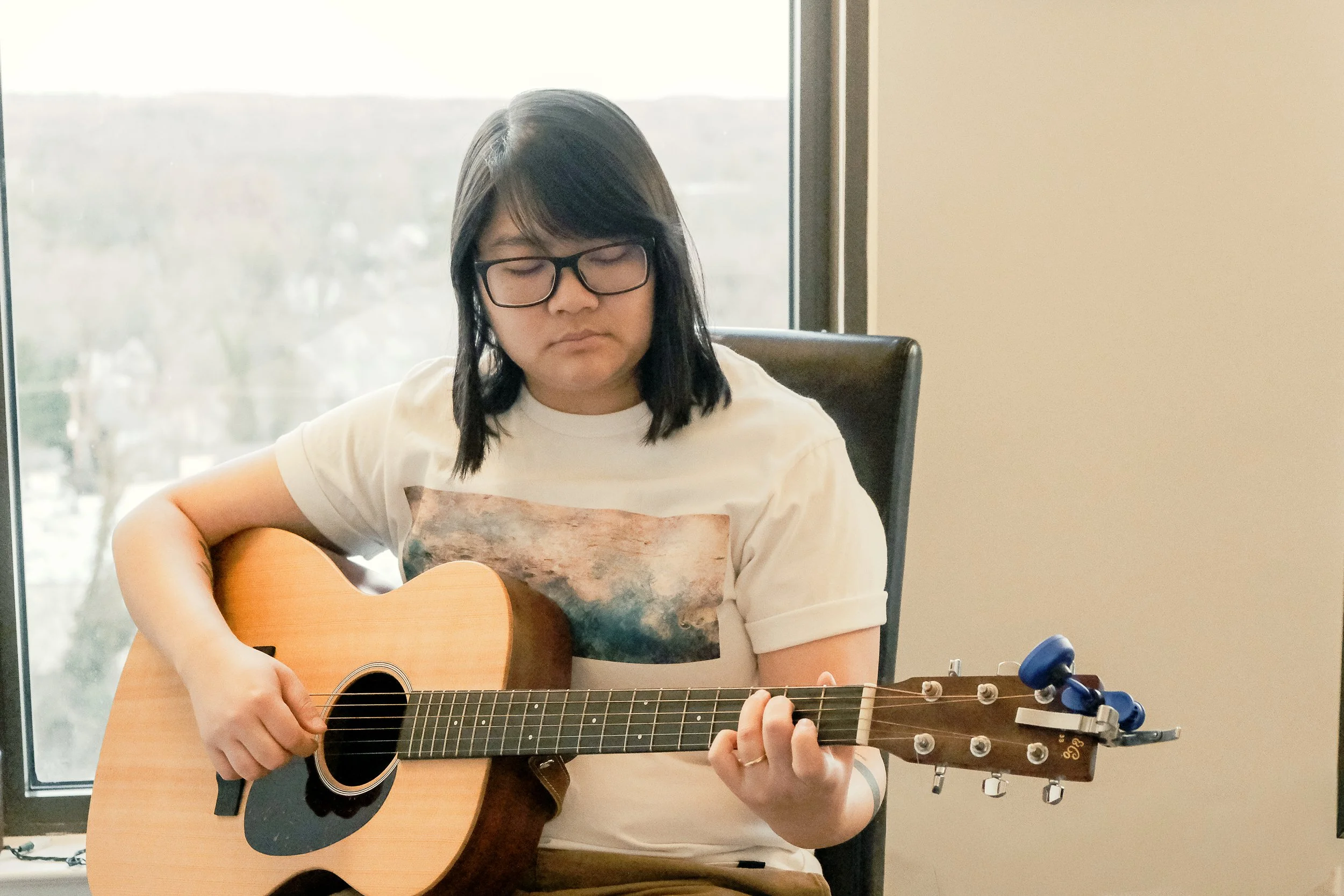 Taissa loves to play the acoustic guitar and write songs copy.jpg
