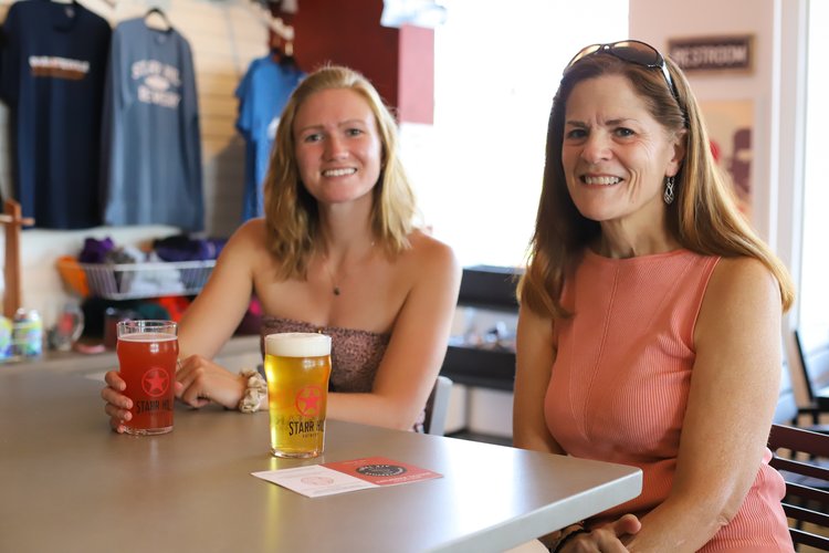 Women enjoying a beer at Starr Hill Charlottesville taproom
