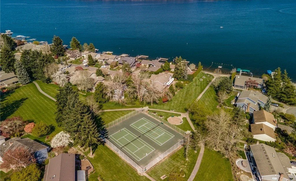 South Cove Issaquah private 4-acre Commons park with beach swim dock tennis courts and playground facilities Lake Sammamish
