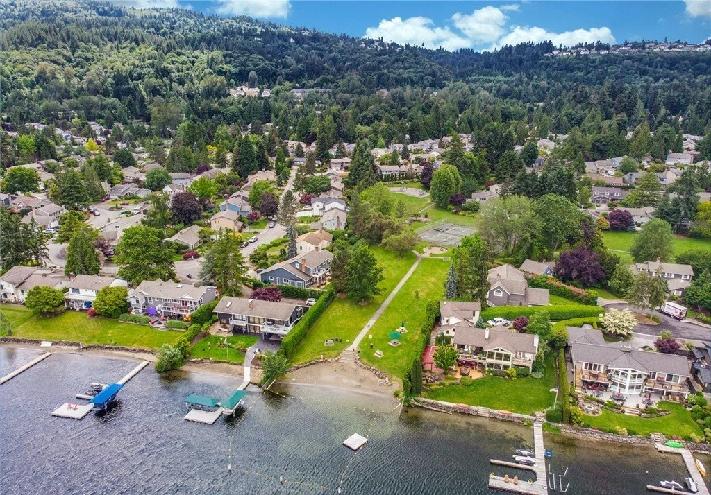 Aerial view of South Cove Issaquah neighborhoods along Lake Sammamish at sunset showing 289 homes and private waterfront access