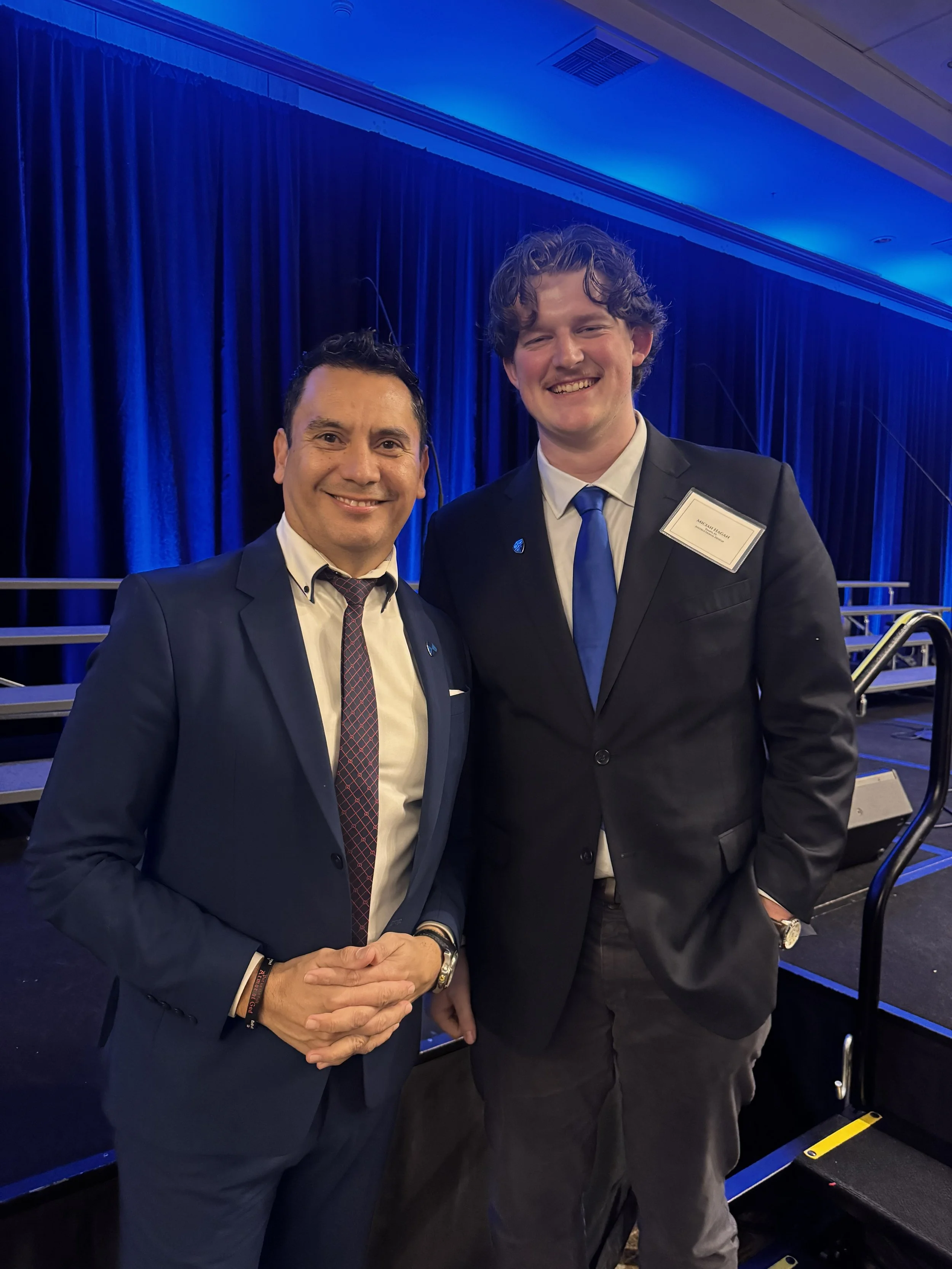 Freddy Delgadillo presenting Northwest University pin to incoming Student Body President Miciah Hagan at Presidents Banquet 2025