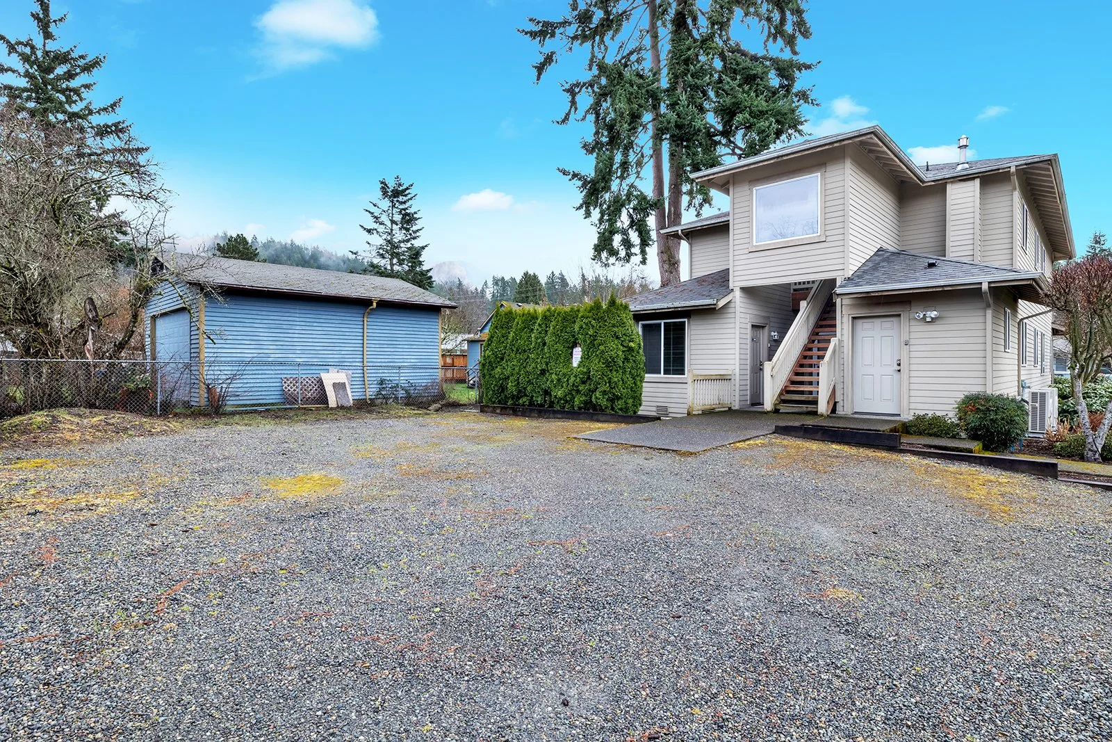 Aerial exterior view of 260 SE Andrews Street duplex in Old Town Issaquah showing full two-story structure, property footprint, surrounding neighborhood, and proximity to Downtown Issaquah — MLS# 2487262