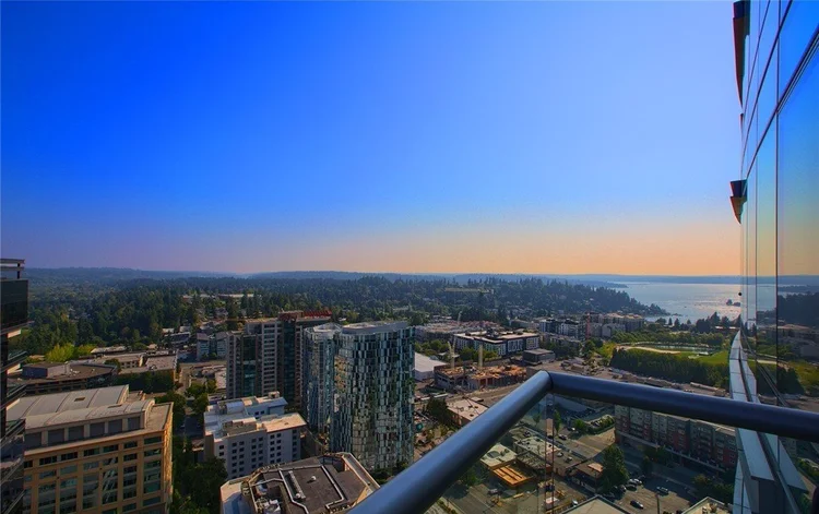 Sunset view of Lake Washington and the Bellevue skyline from a high-floor Bellevue Towers balcony