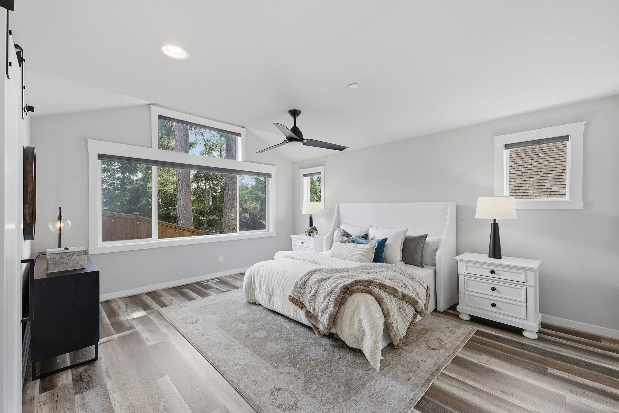 Primary bedroom with ceiling fan and natural light, Hawthorne Park Redmond luxury home