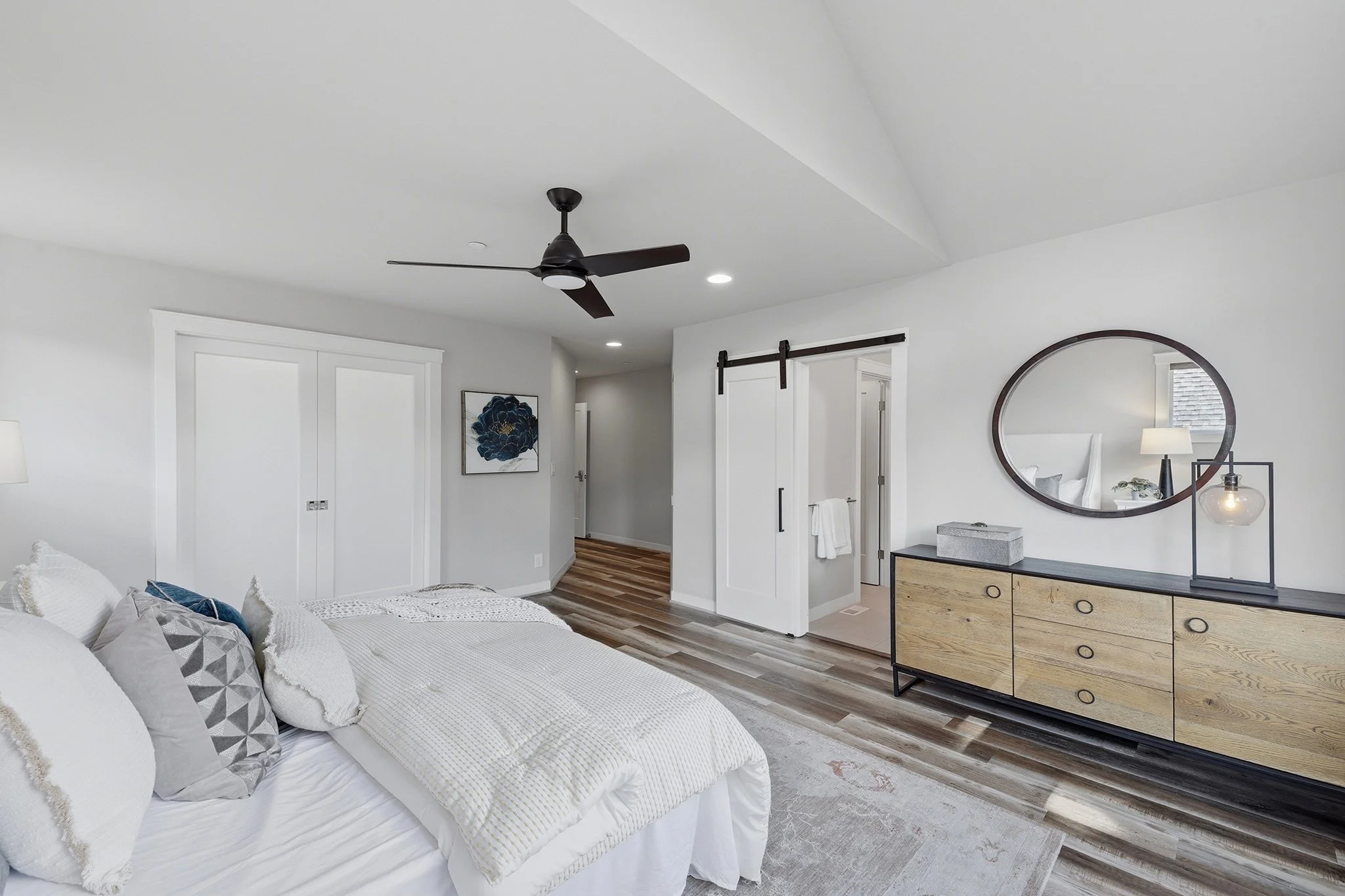 Bedroom with barn door closet and modern dresser, Redmond English Hill new construction
