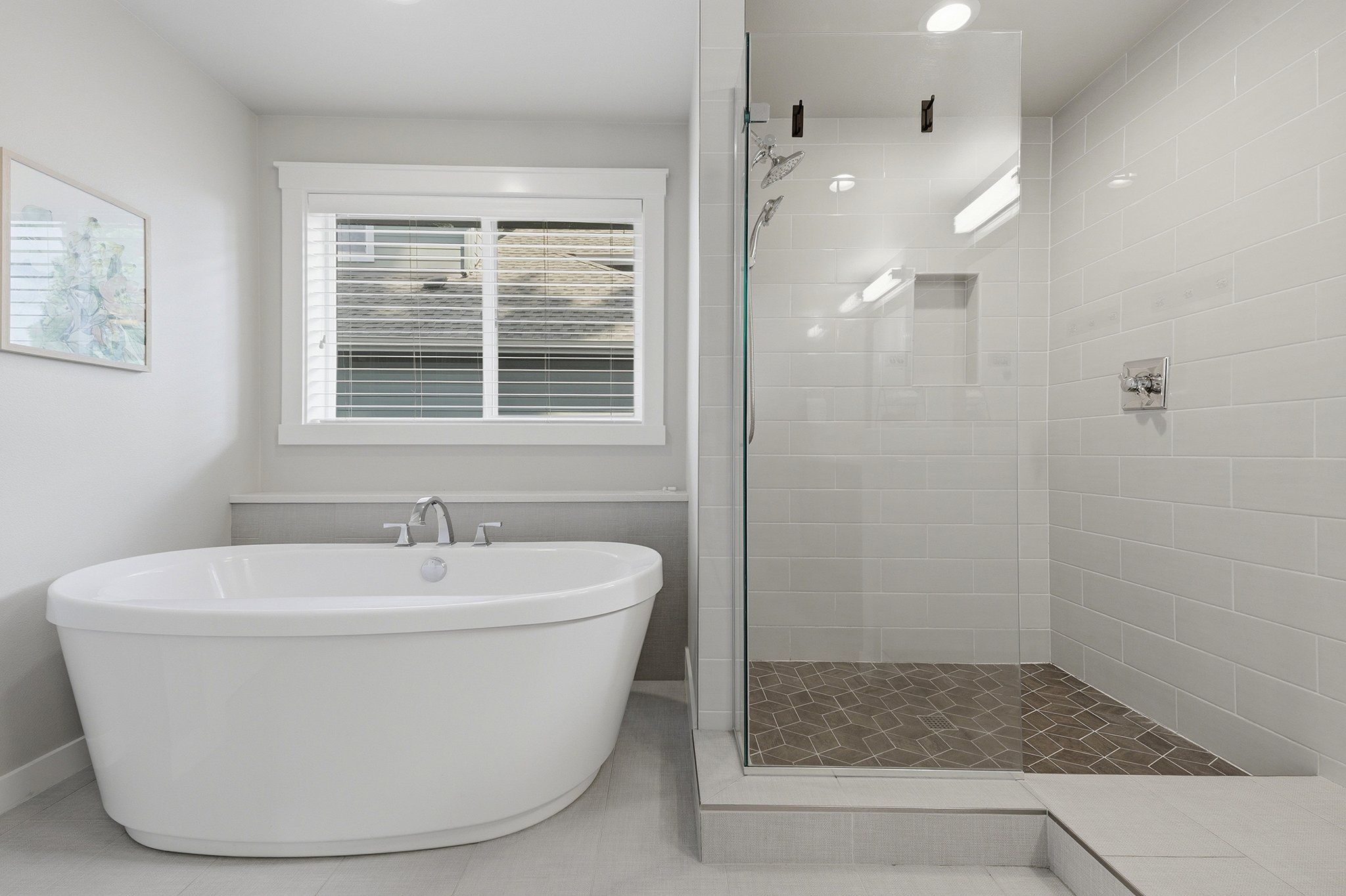 Spa-style bathroom with freestanding soaking tub and glass shower, English Hill Redmond luxury home