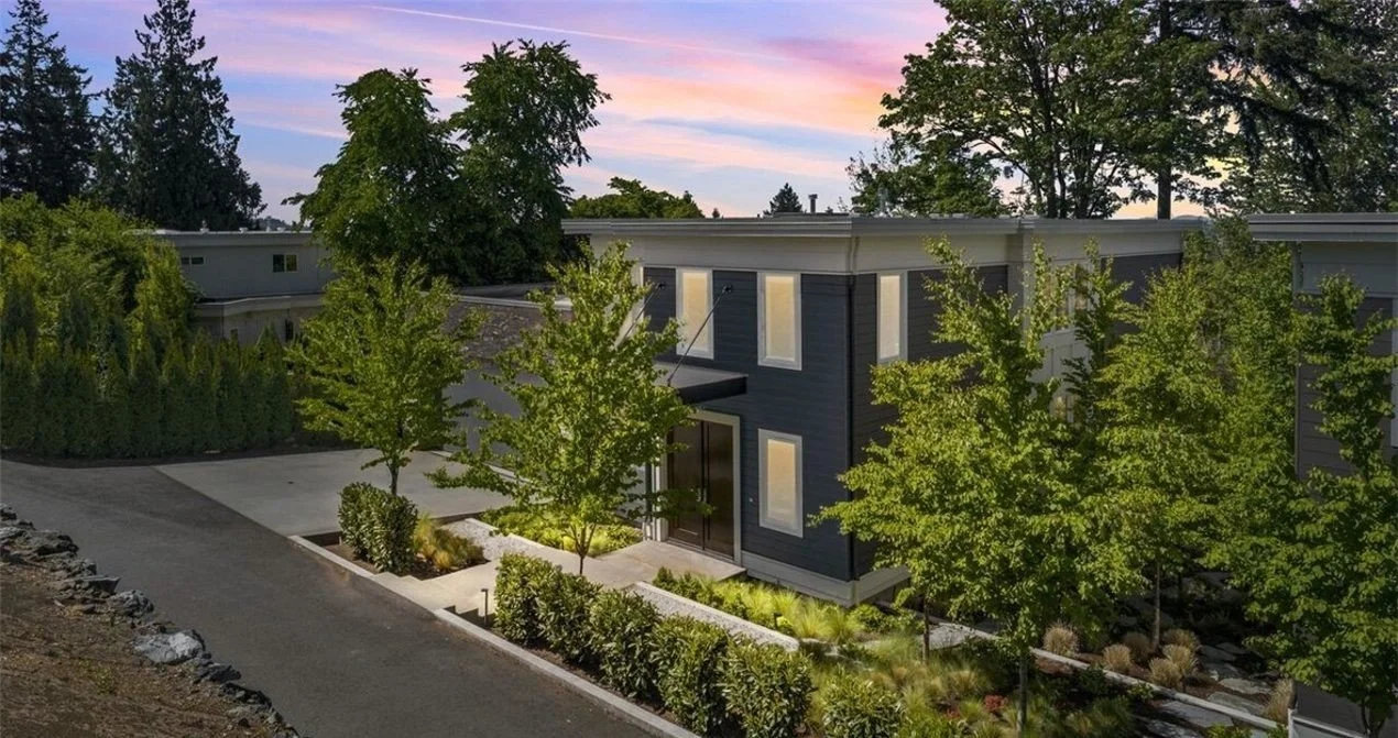 Custom luxury home built by Casady Homes in Kirkland Highlands, listed exclusively by Freddy Delgadillo of Realogics Sotheby's International Realty — front elevation with Cascade Mountain views