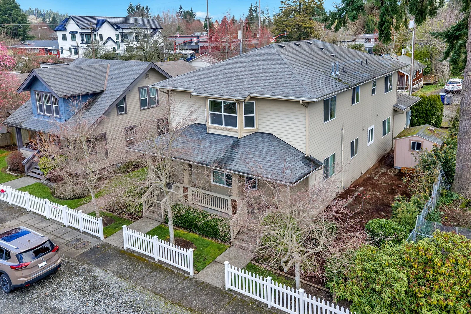 Aerial side view of income-producing duplex at 260 SE Andrews Street Issaquah WA showing two-story structure, dual entrances, and neighborhood setting in Old Town Issaquah — ideal 1031 Exchange investment property