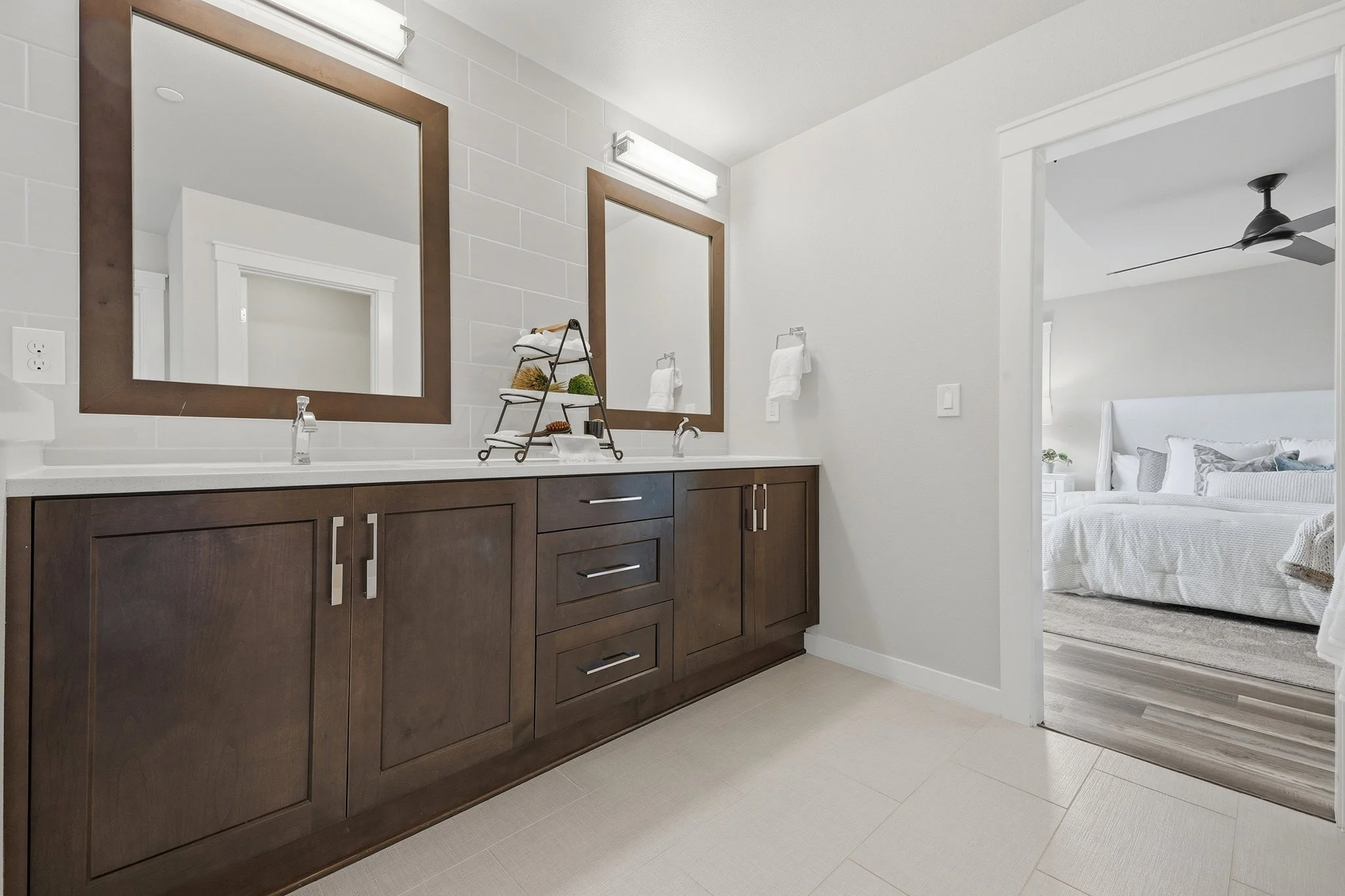 Dual-vanity bathroom with wood-framed mirrors and walk-in shower, Redmond WA home for sale