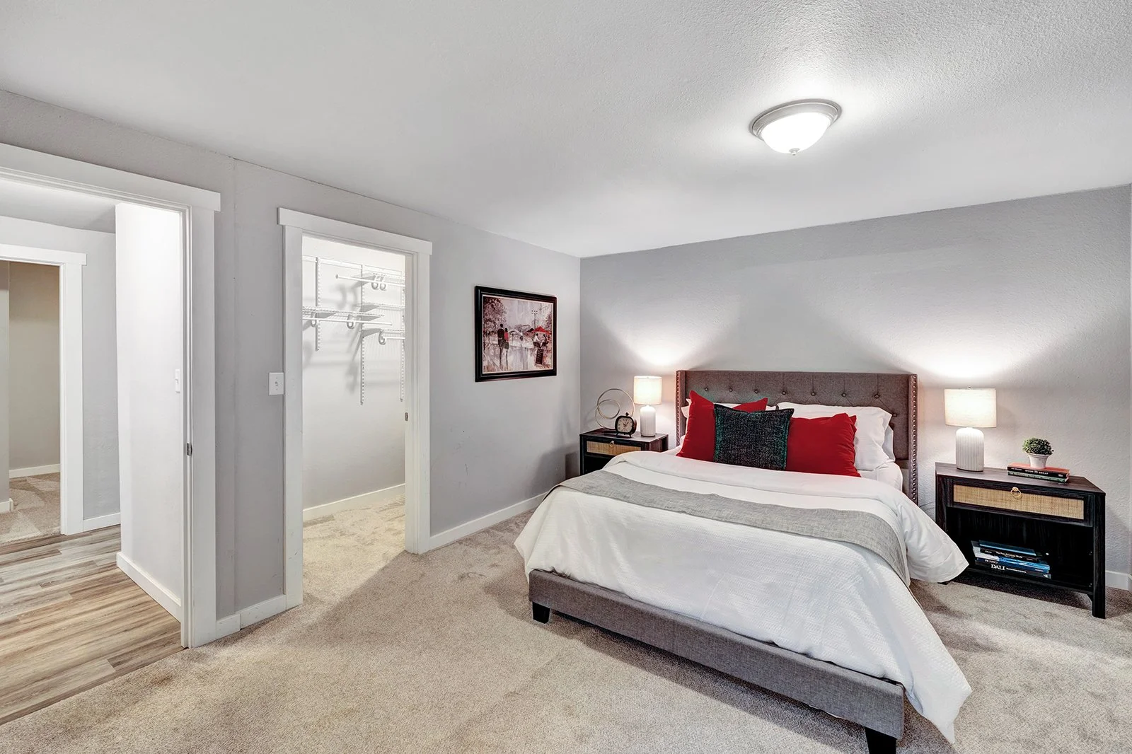 Spacious primary bedroom suite in Finn Hill home with walk-in closet and private bath featuring contemporary finishes and neutral tones