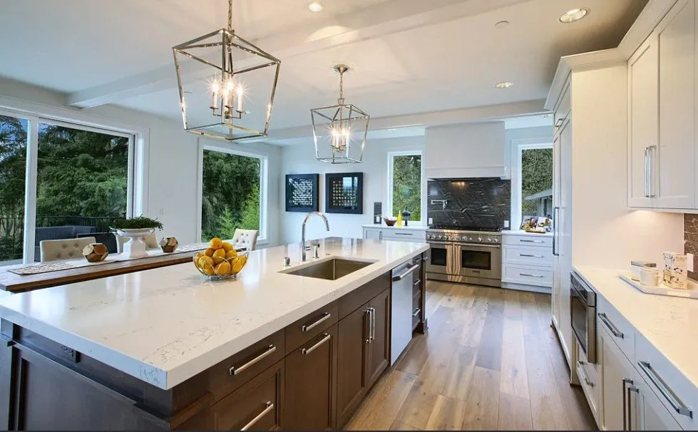 Gourmet chef's kitchen in a Casady Homes custom estate in Kirkland — featuring Thermador appliances, White Carrara marble countertops, custom cabinetry, and a butler's pantry